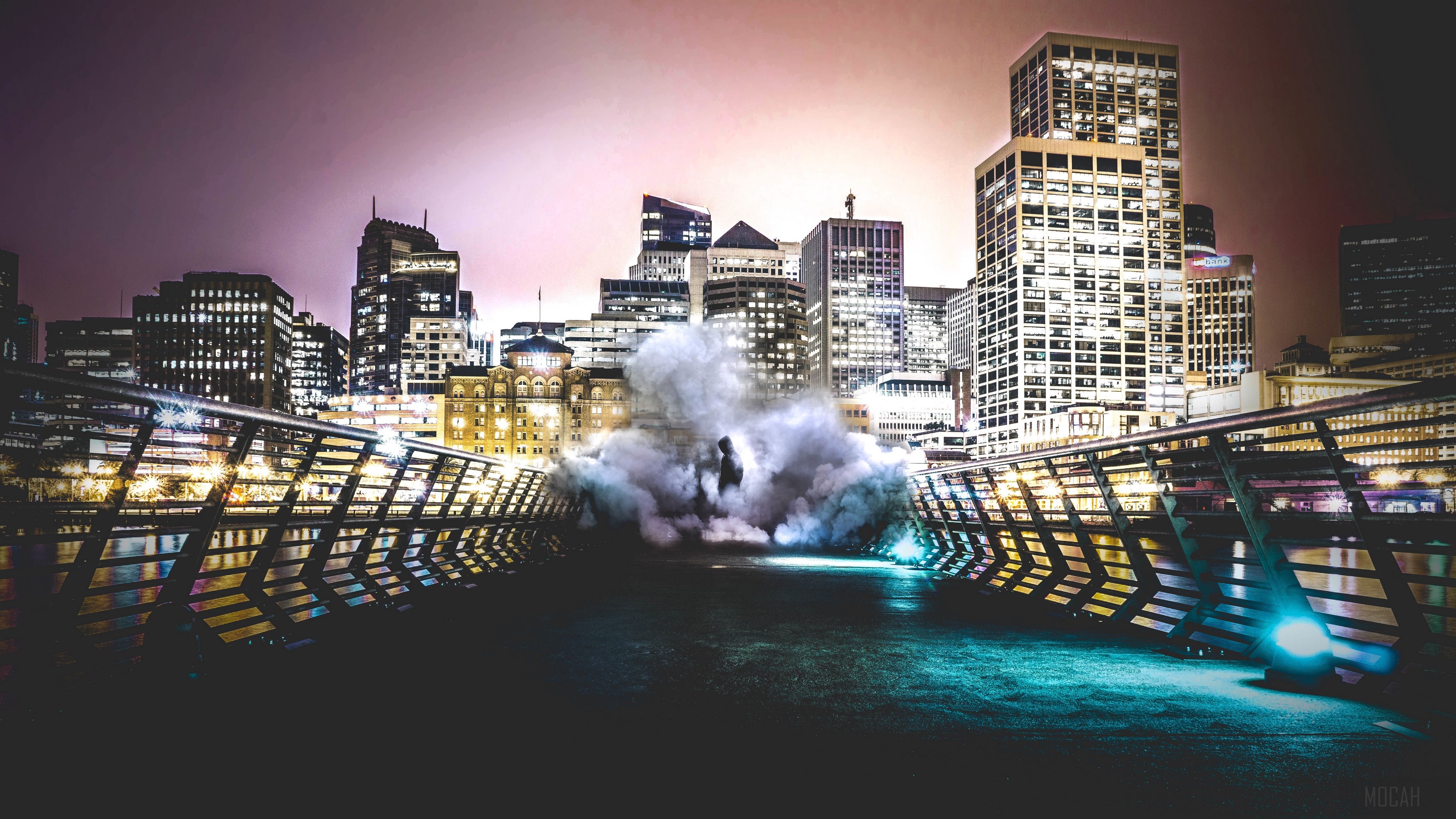 Man in smoke on bridge with city skyline at night 4K HD Wallpaper