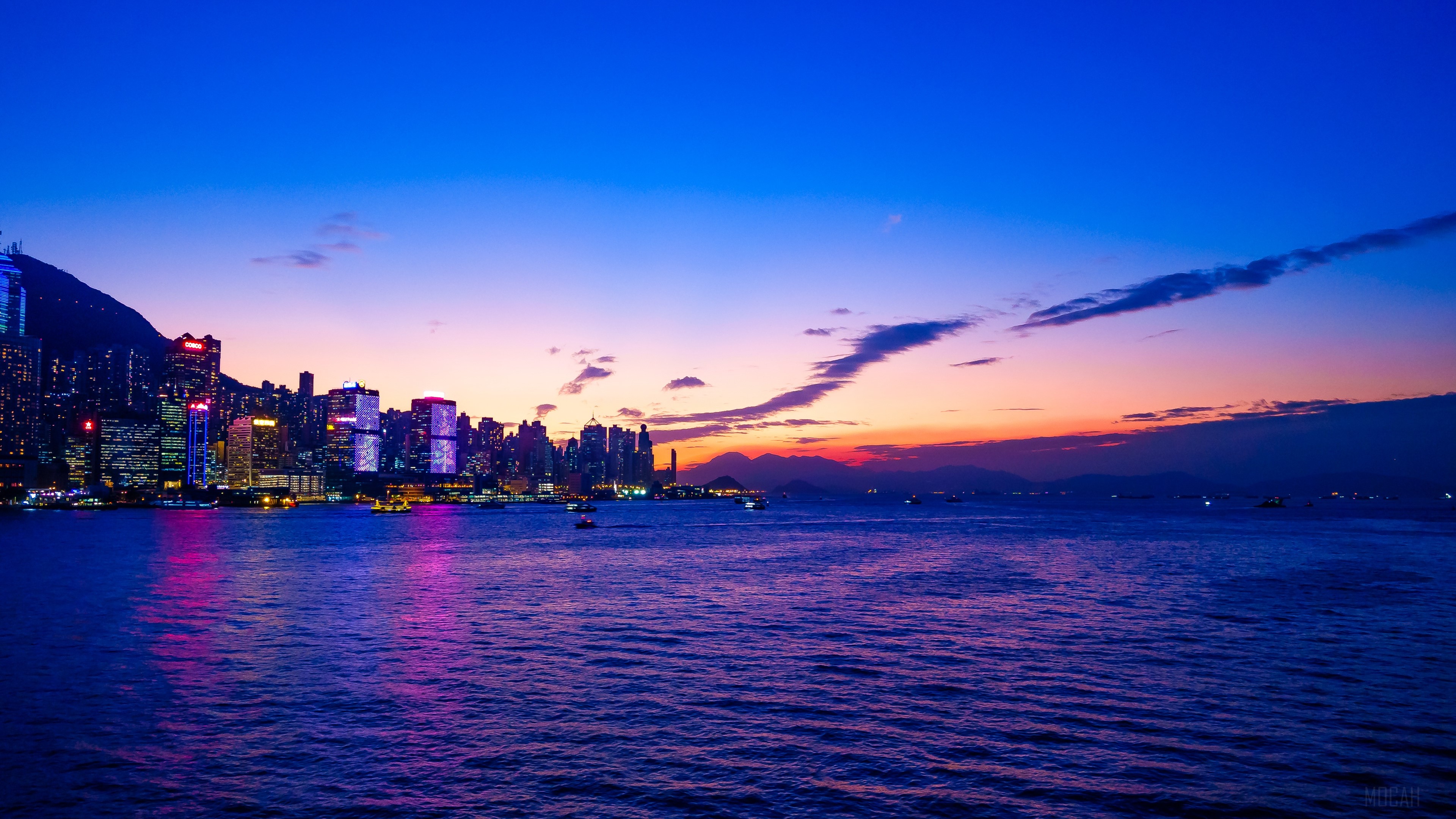 Hong Kong skyline at sunset over the water 4K HD Wallpaper