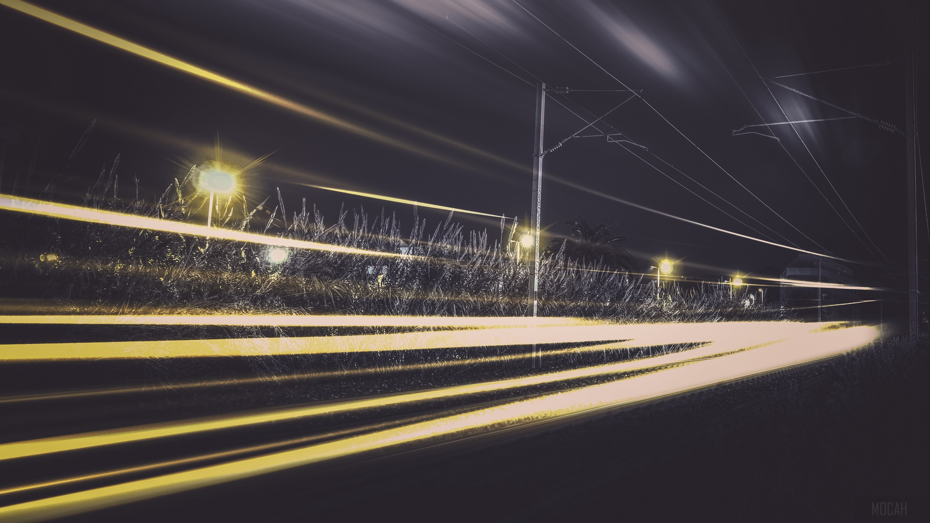 Light trails on a railway at night HD Wallpaper