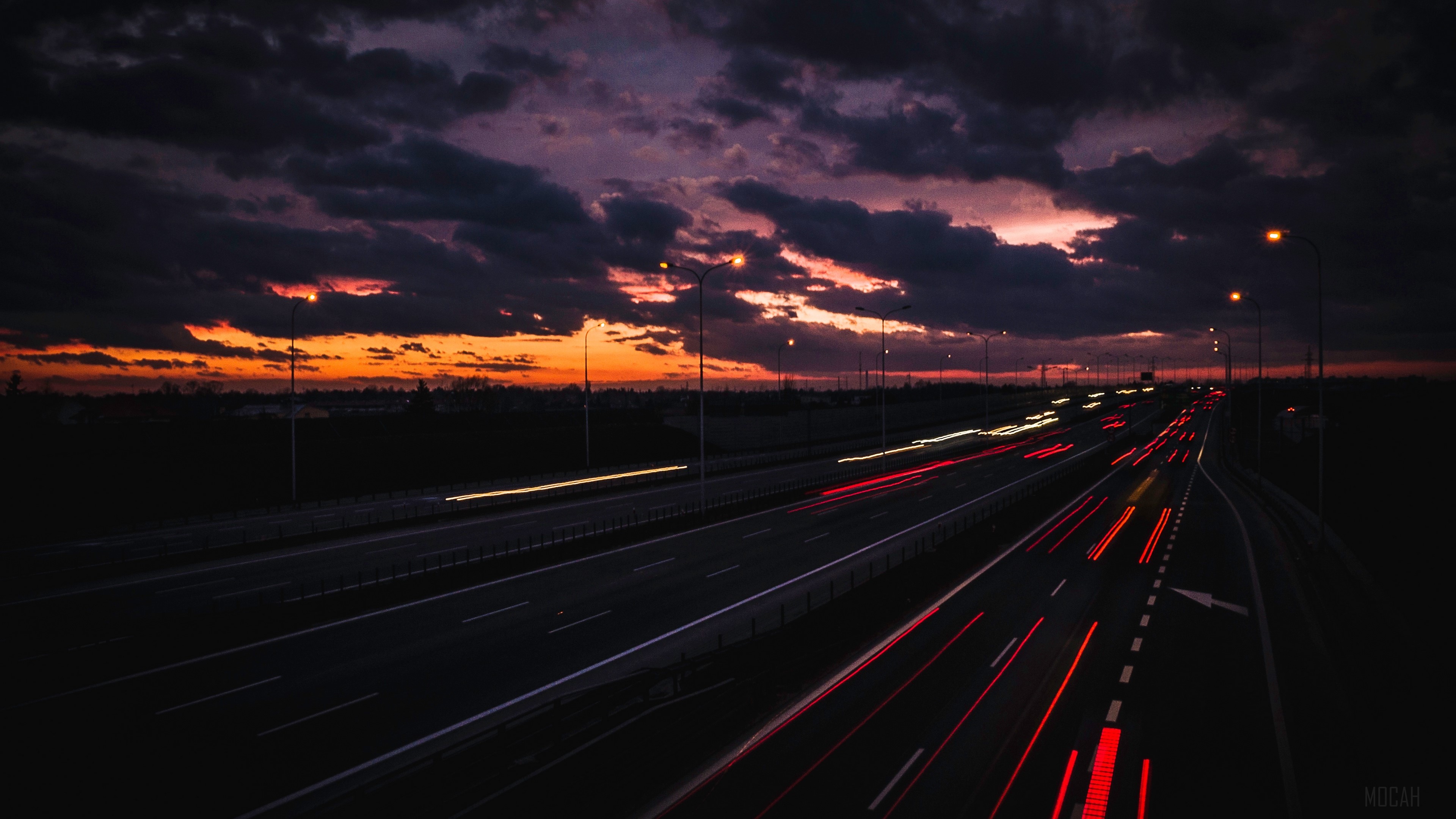 Highway at night with light trails and sunset clouds 4K HD Wallpaper