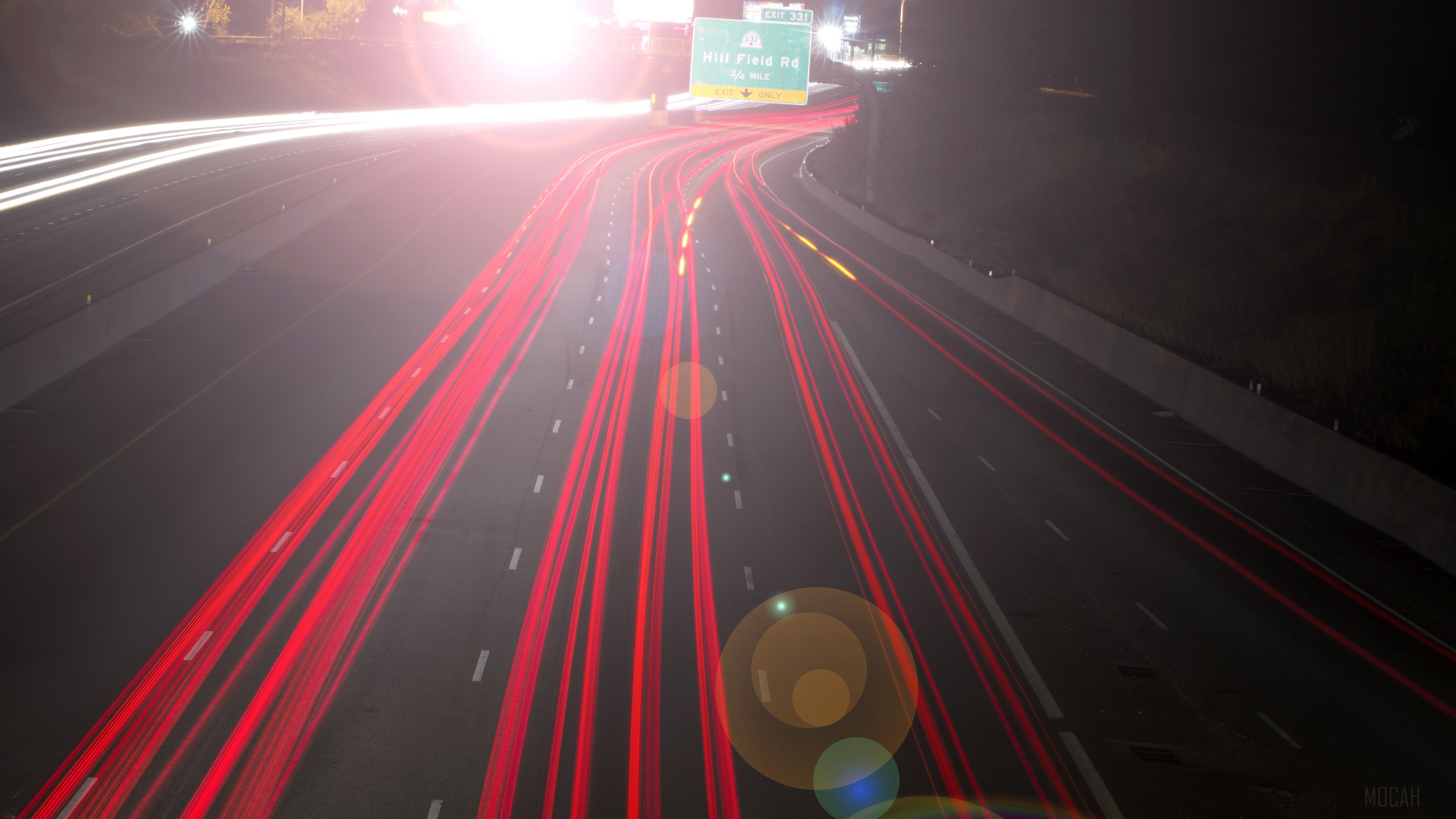 Highway Light Trails with Exit Sign HD Wallpaper