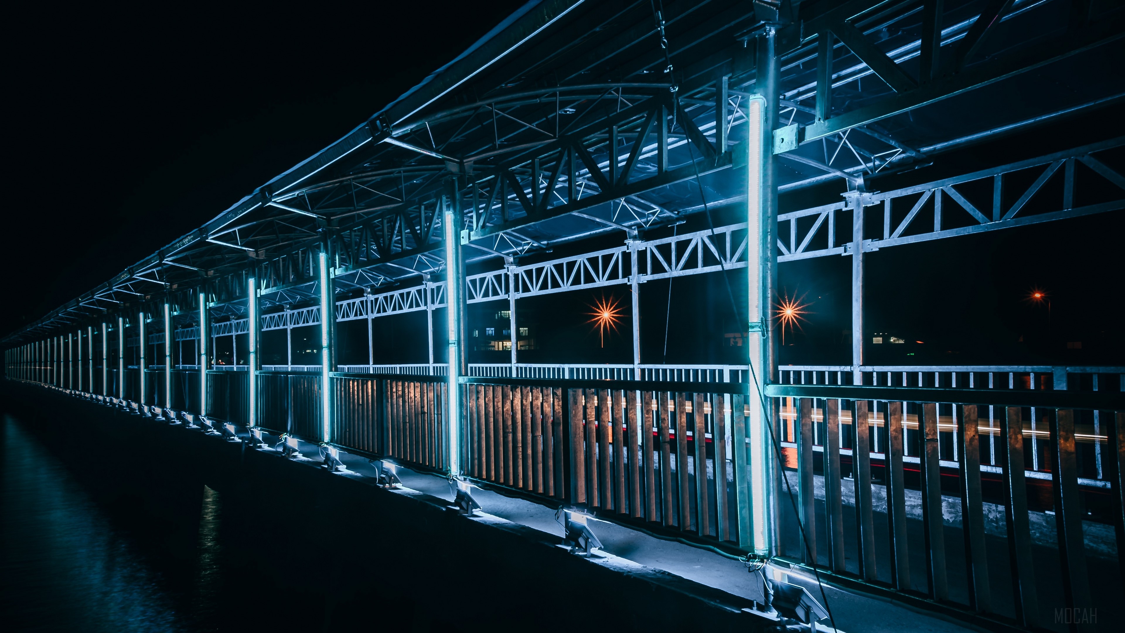 Bridge with blue lights at night HD Wallpaper