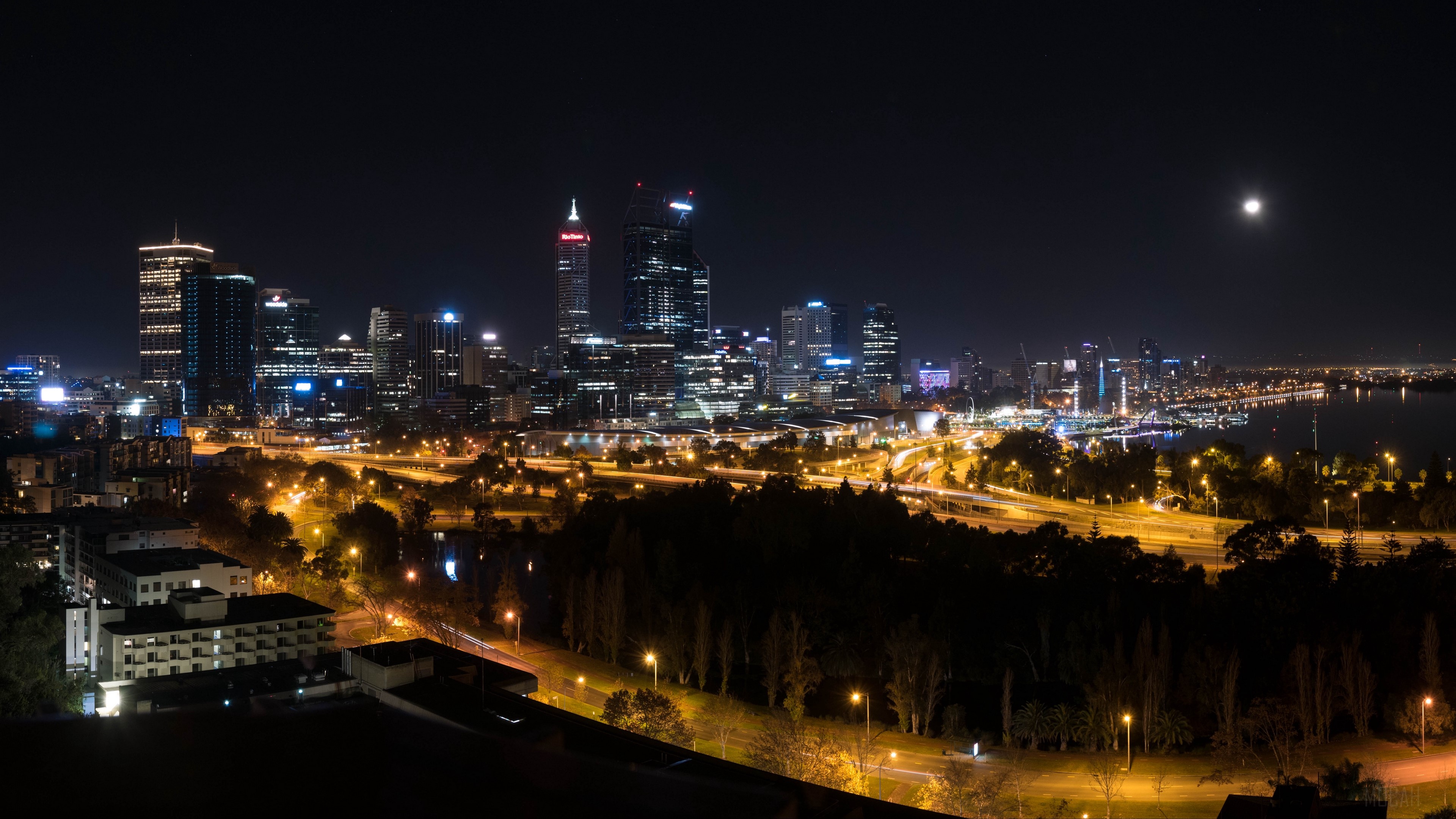 Night city skyline with skyscrapers and moon HD Wallpaper