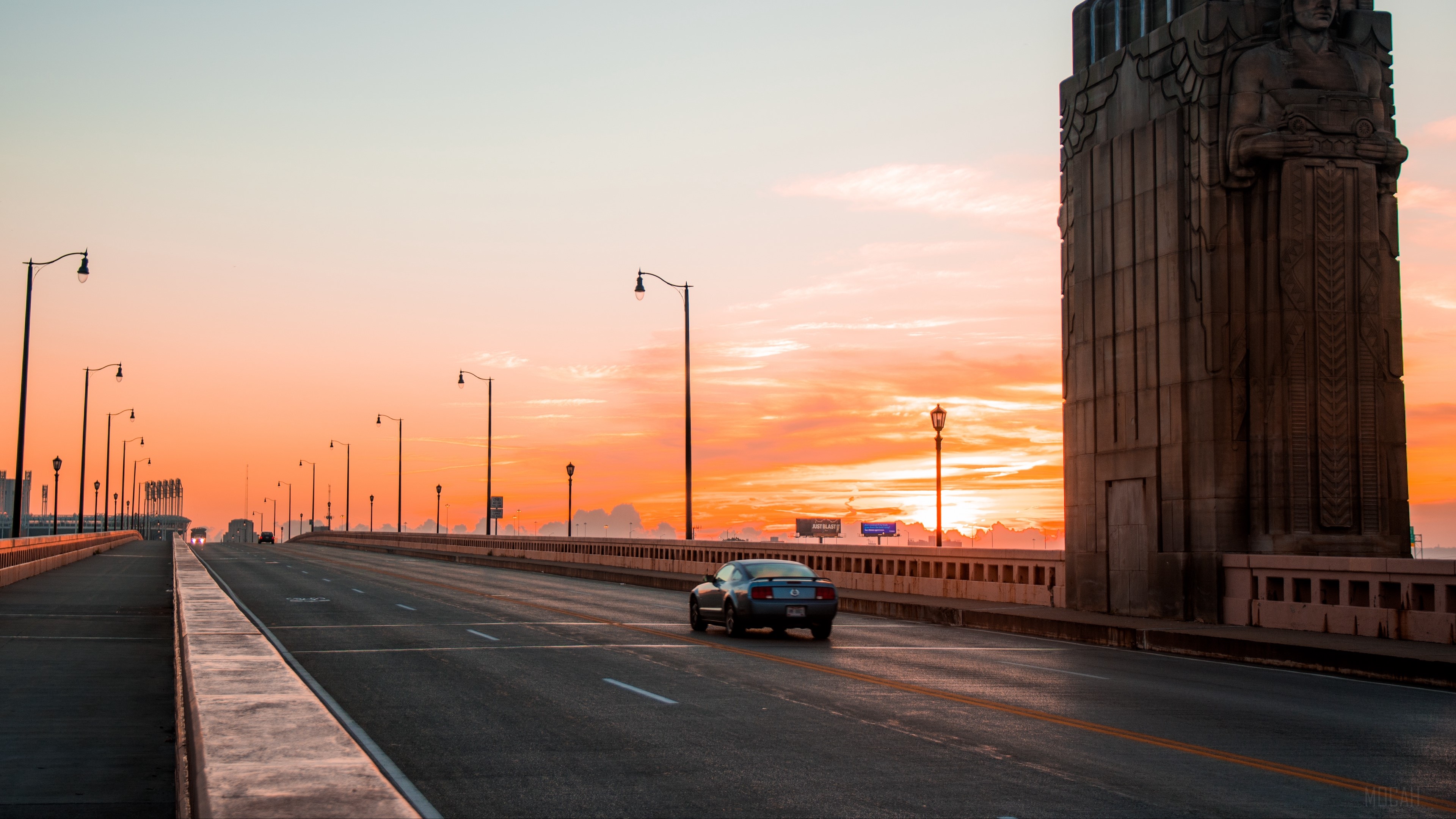 Car on Cleveland Bridge at Sunset 4K HD Wallpaper