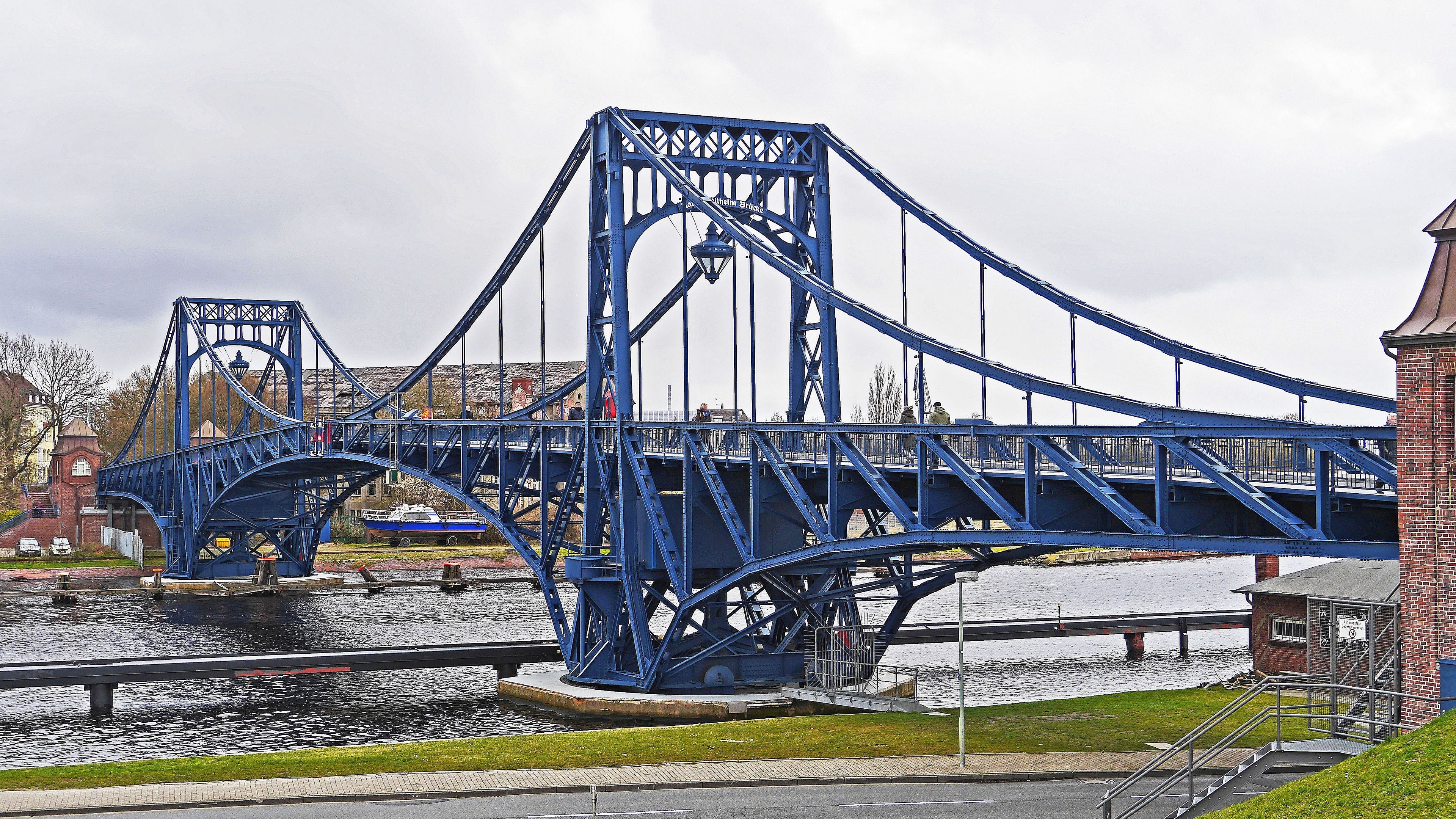Blue bascule bridge over a canal in Wilhelmshaven 4K HD Wallpaper