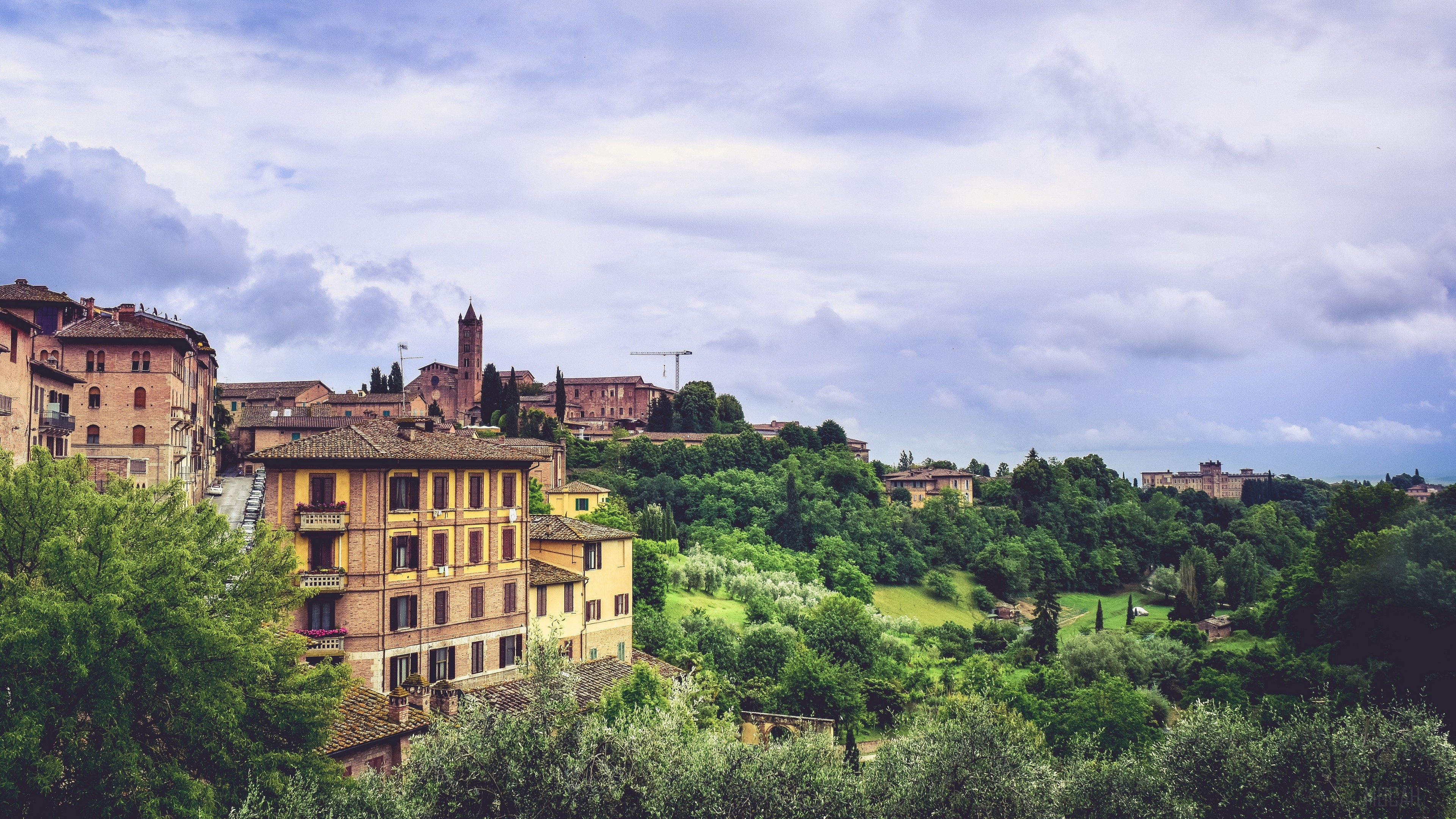 Siena, Italy cityscape with buildings and trees 4K HD Wallpaper