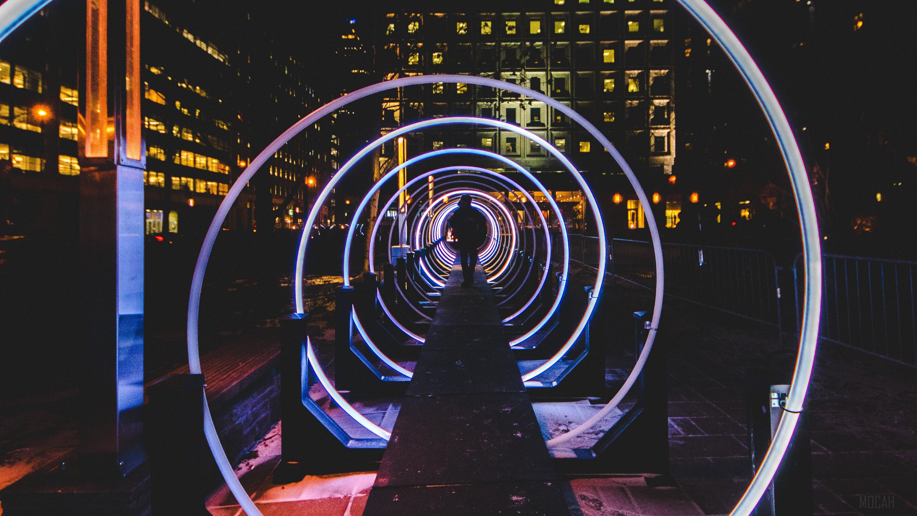 Silhouette in a glowing tunnel at night HD Wallpaper