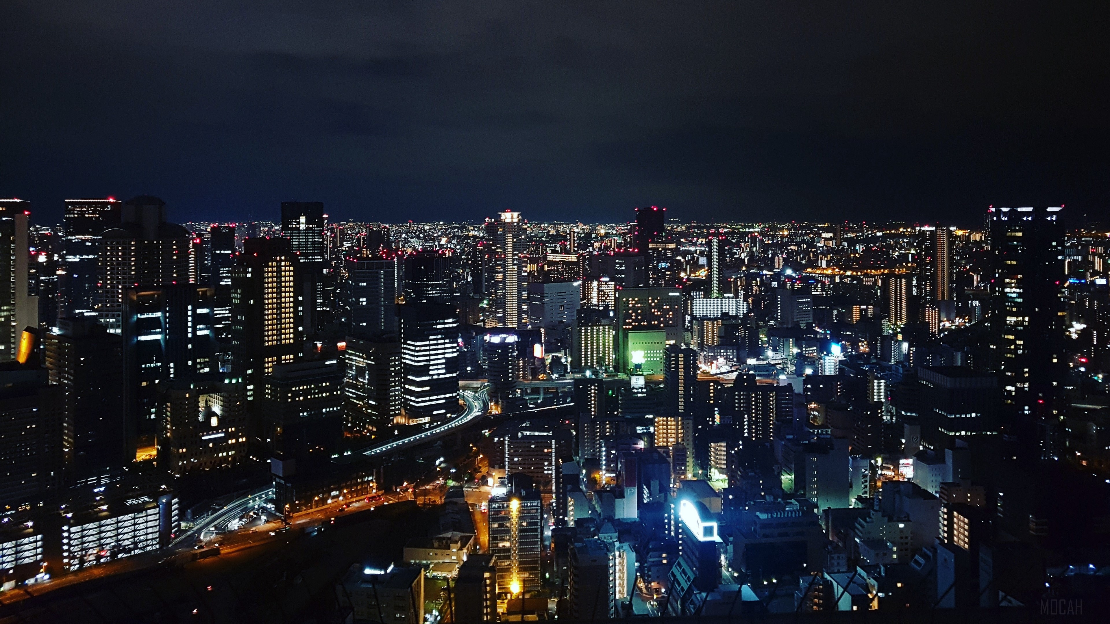 Night city skyline with illuminated buildings 4K HD Wallpaper