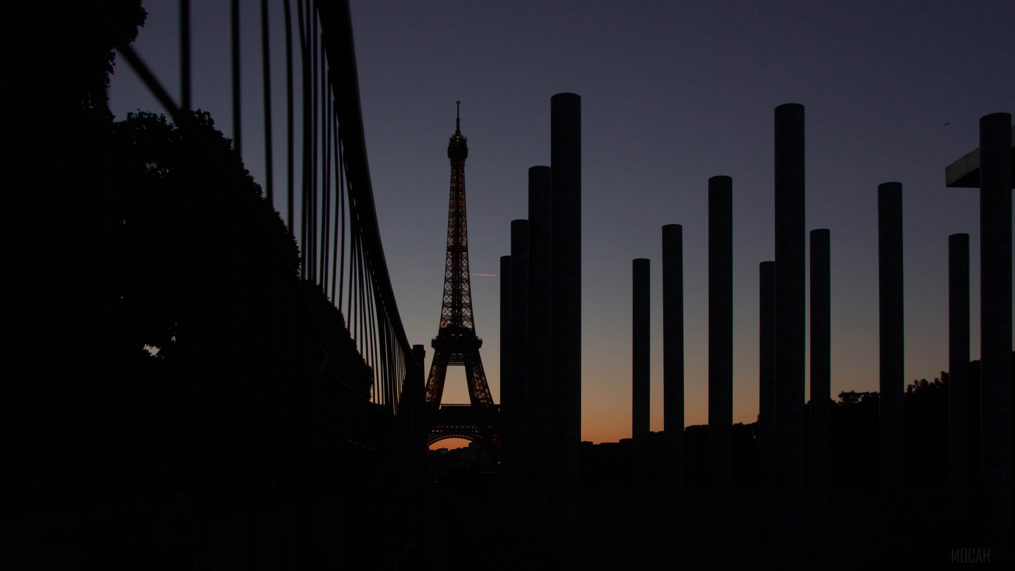 Eiffel Tower at dusk with foreground pillars HD Wallpaper