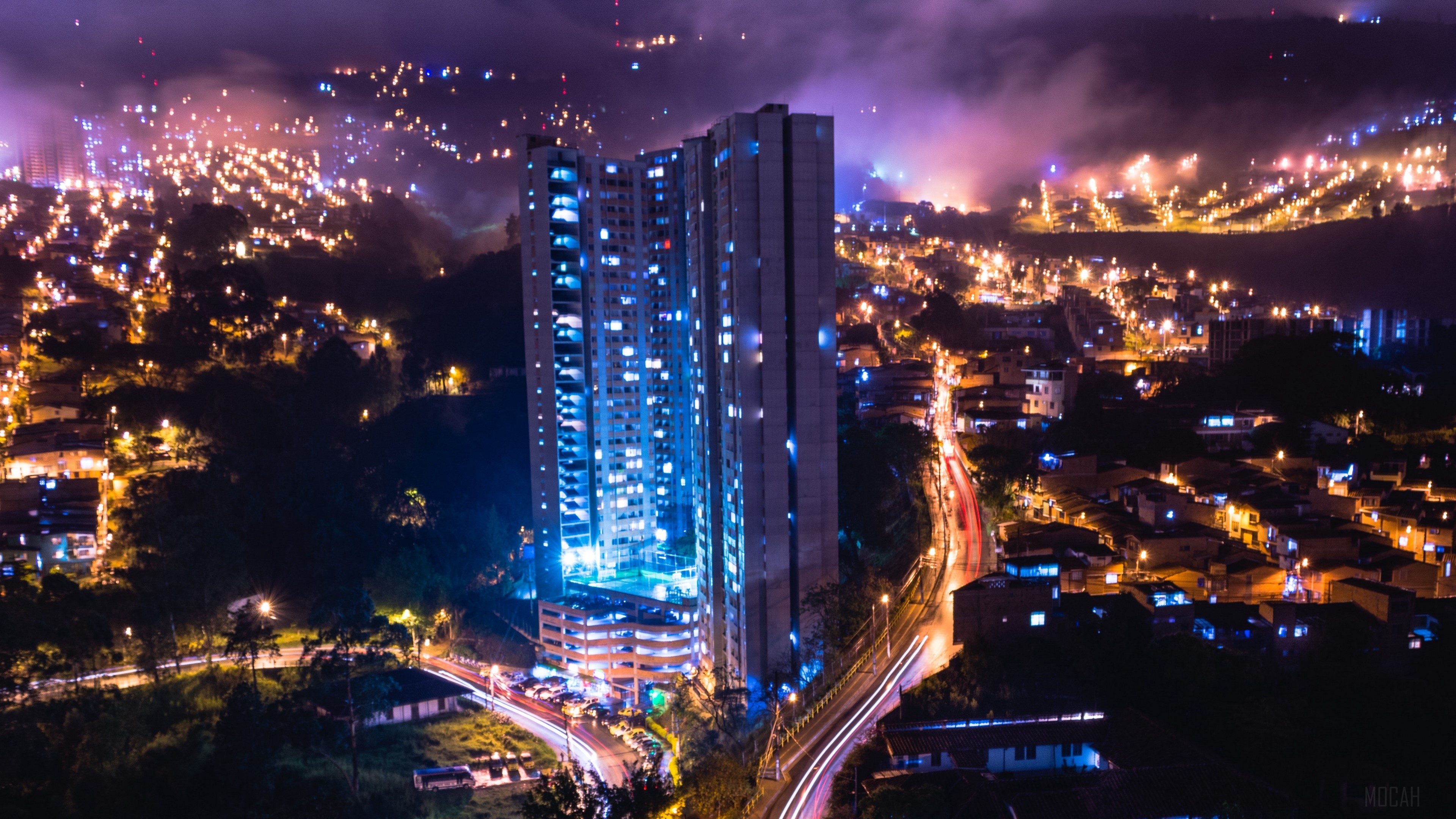 Night city skyline with illuminated skyscraper HD Wallpaper