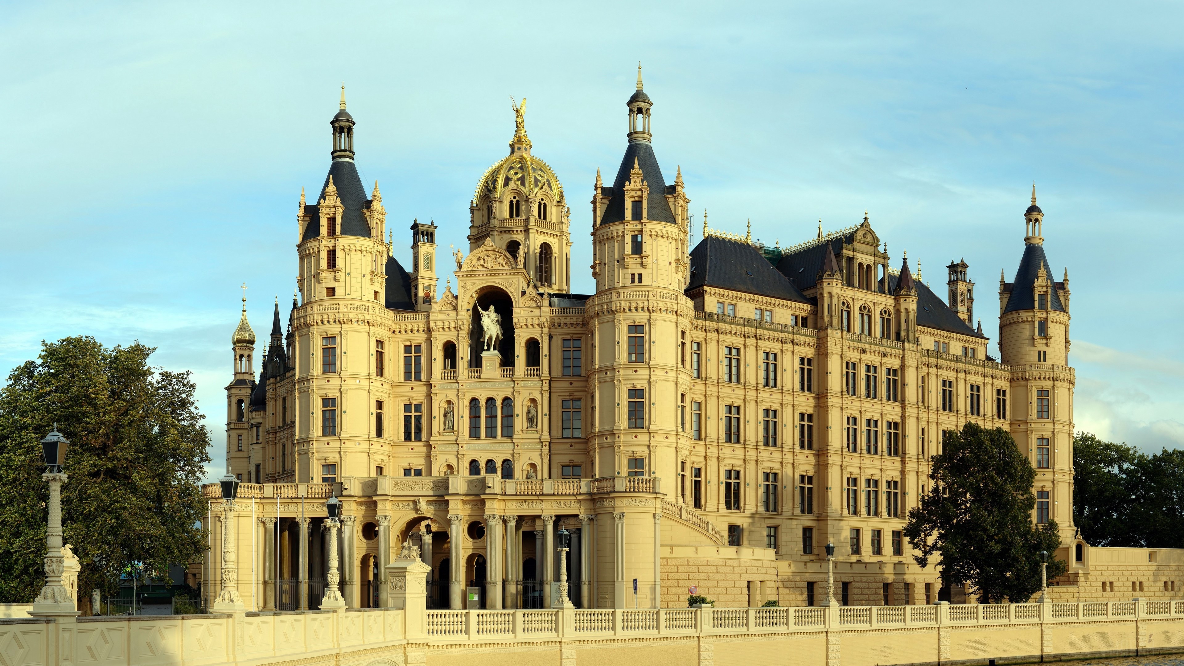 Schwerin Castle on a lake with blue sky HD Wallpaper