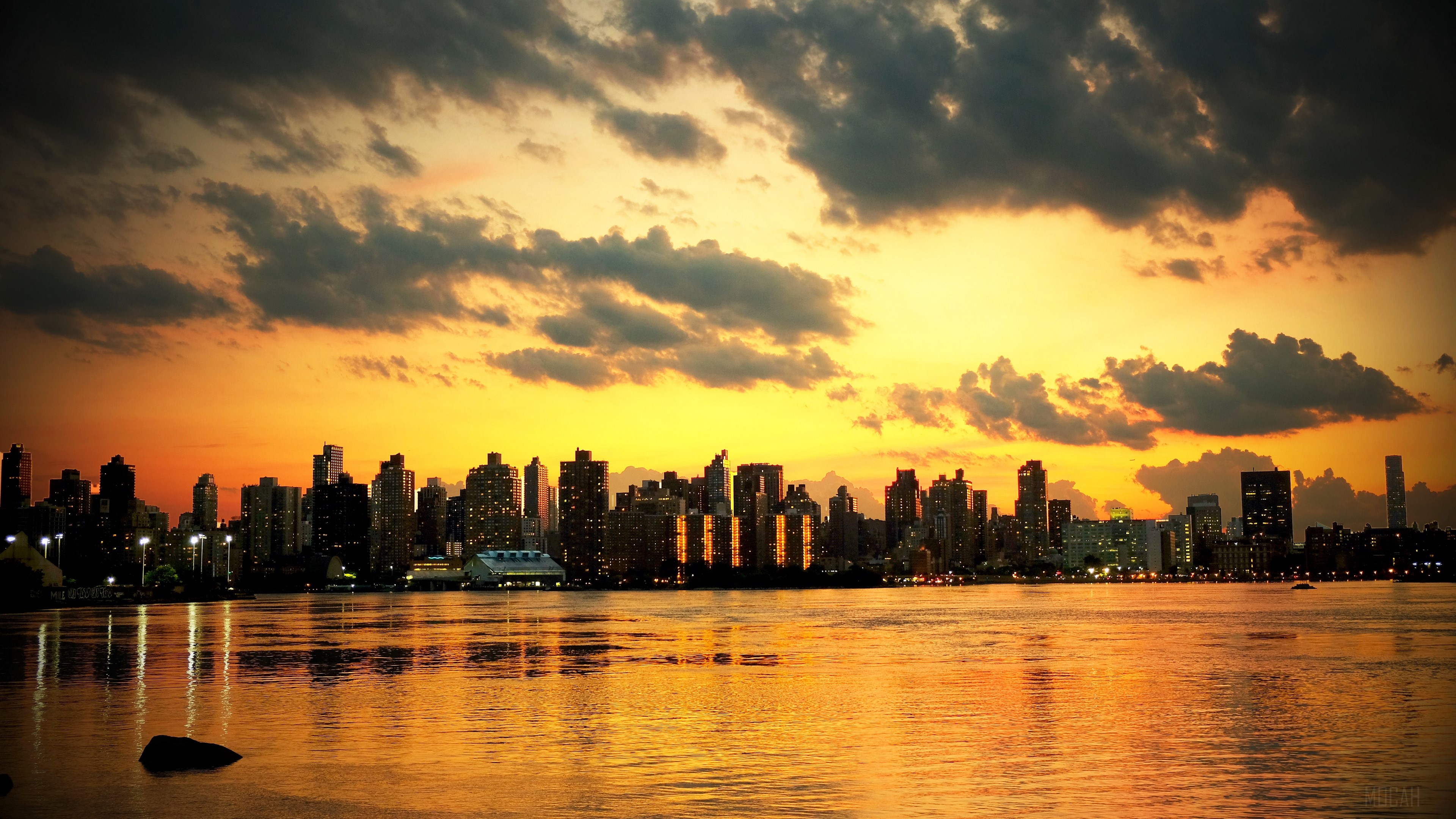 New York City skyline at sunset over the ocean 4K HD Wallpaper