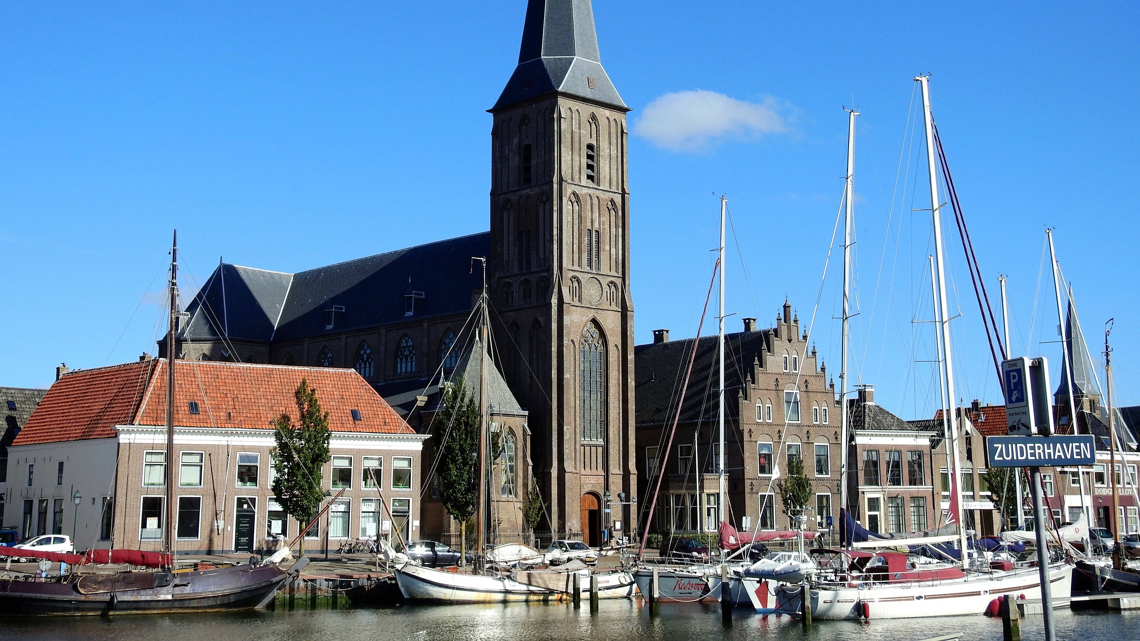 Church and sailboats in a Dutch harbor 4K HD Wallpaper