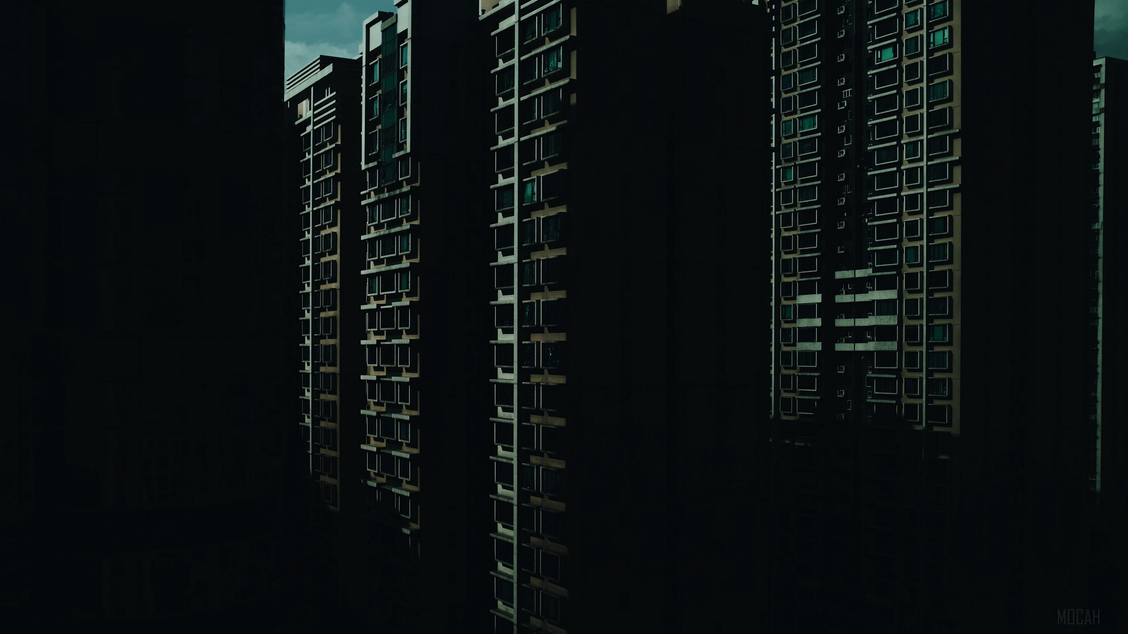 Skyscraper facades in dark urban environment 4K HD Wallpaper