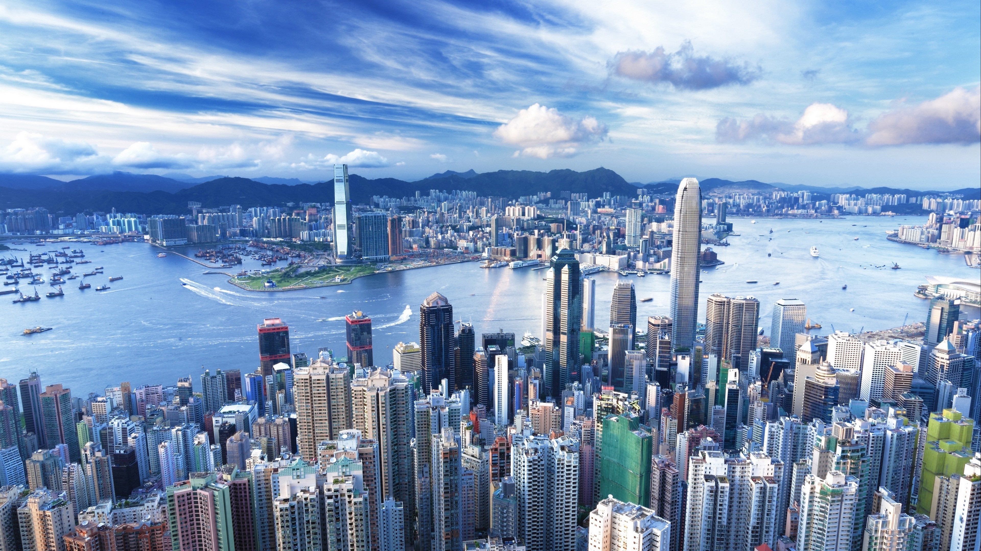 Hong Kong cityscape with Victoria Harbour and mountains 4K HD Wallpaper