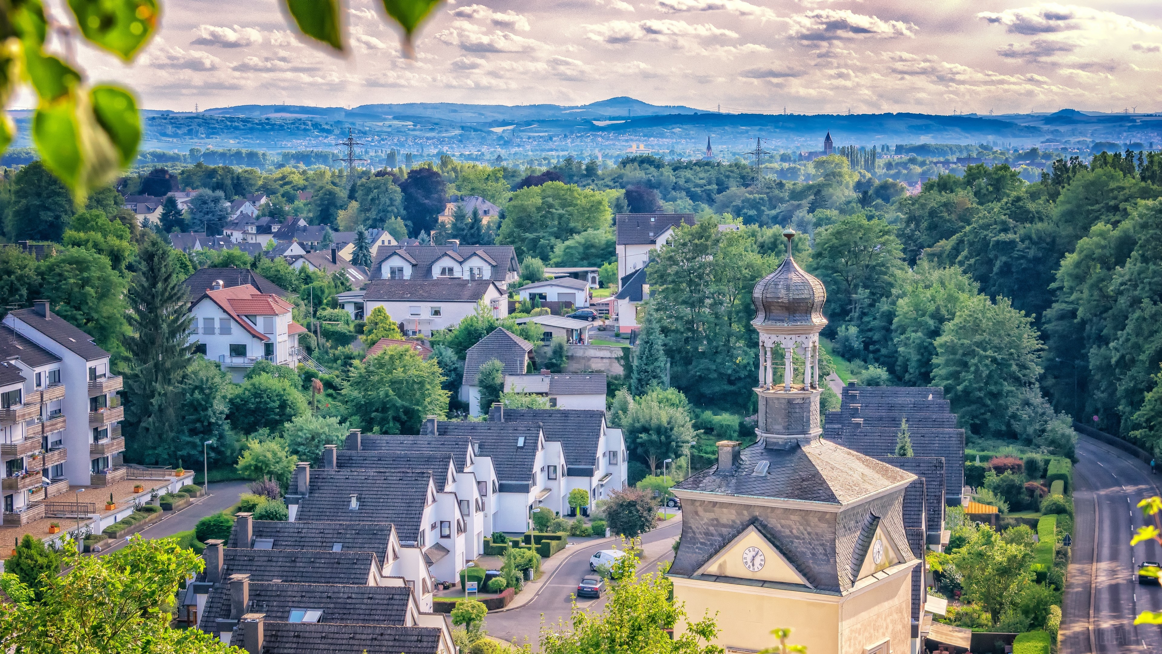 Village with houses and church tower in HDR 4K HD Wallpaper
