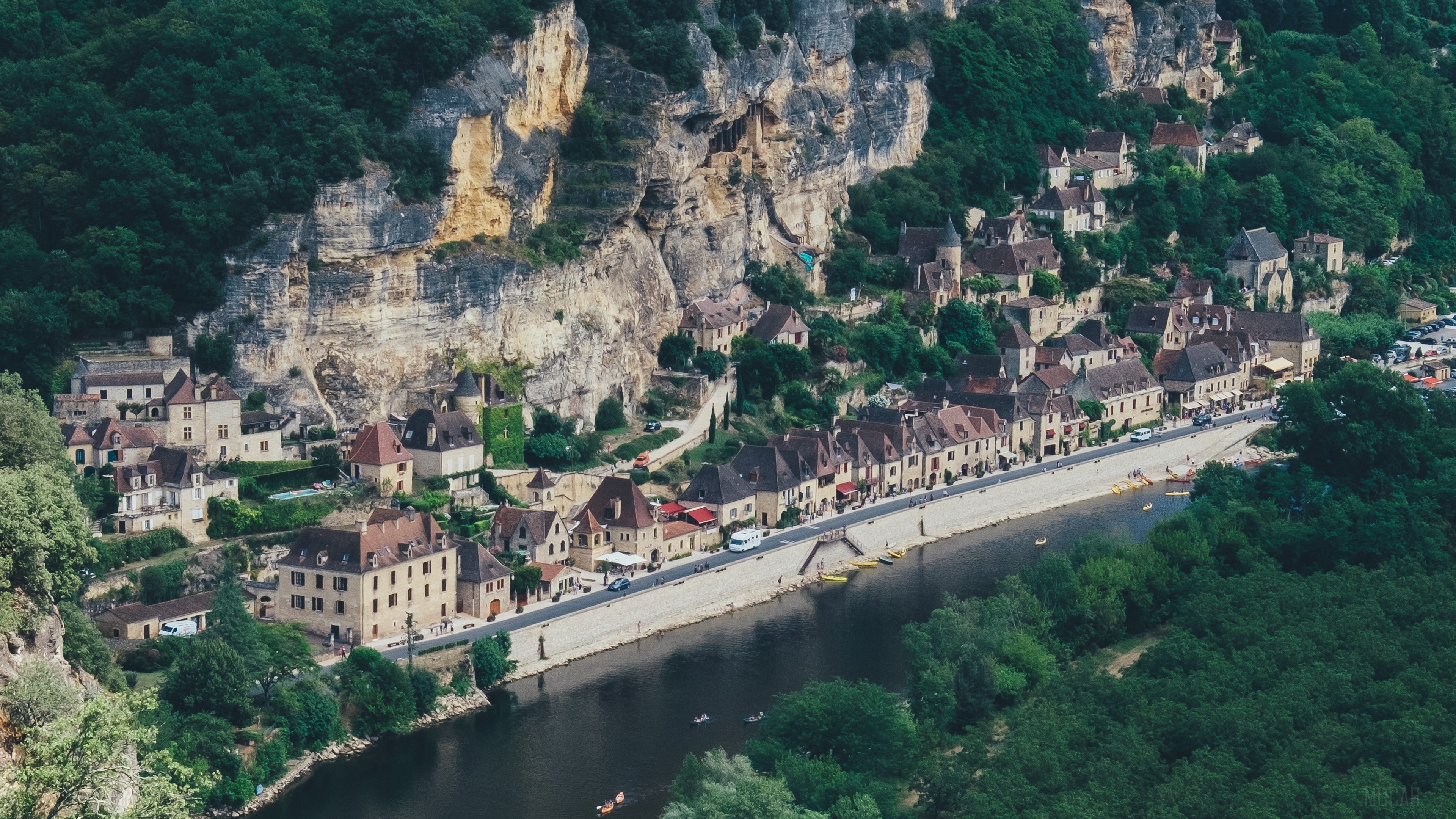 Village on a cliffside by a river in France HD Wallpaper