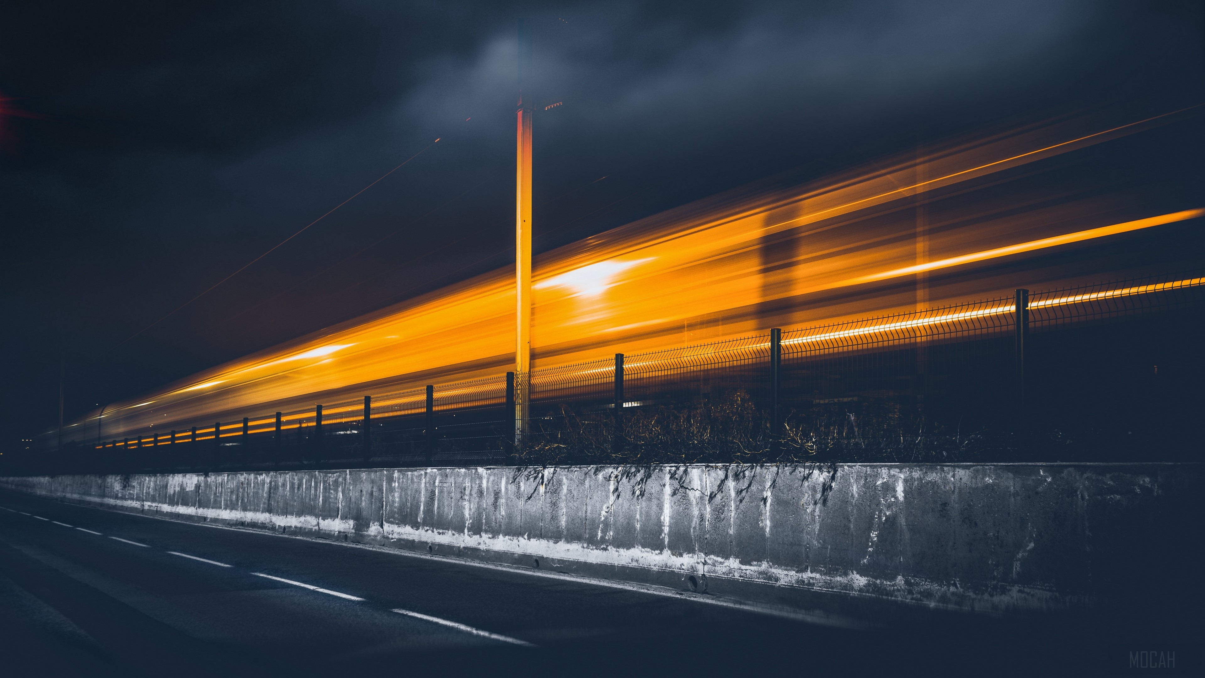 Light trails from a moving object at night HD Wallpaper