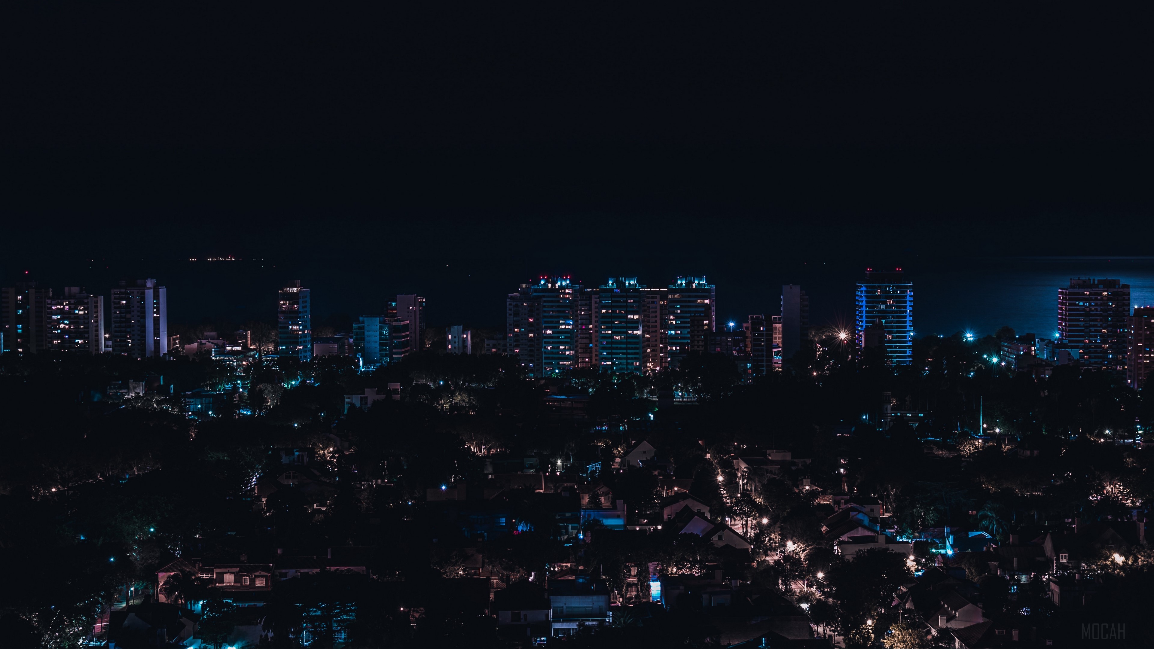 Night city skyline with buildings and city lights in Olivos, Argentina HD Wallpaper