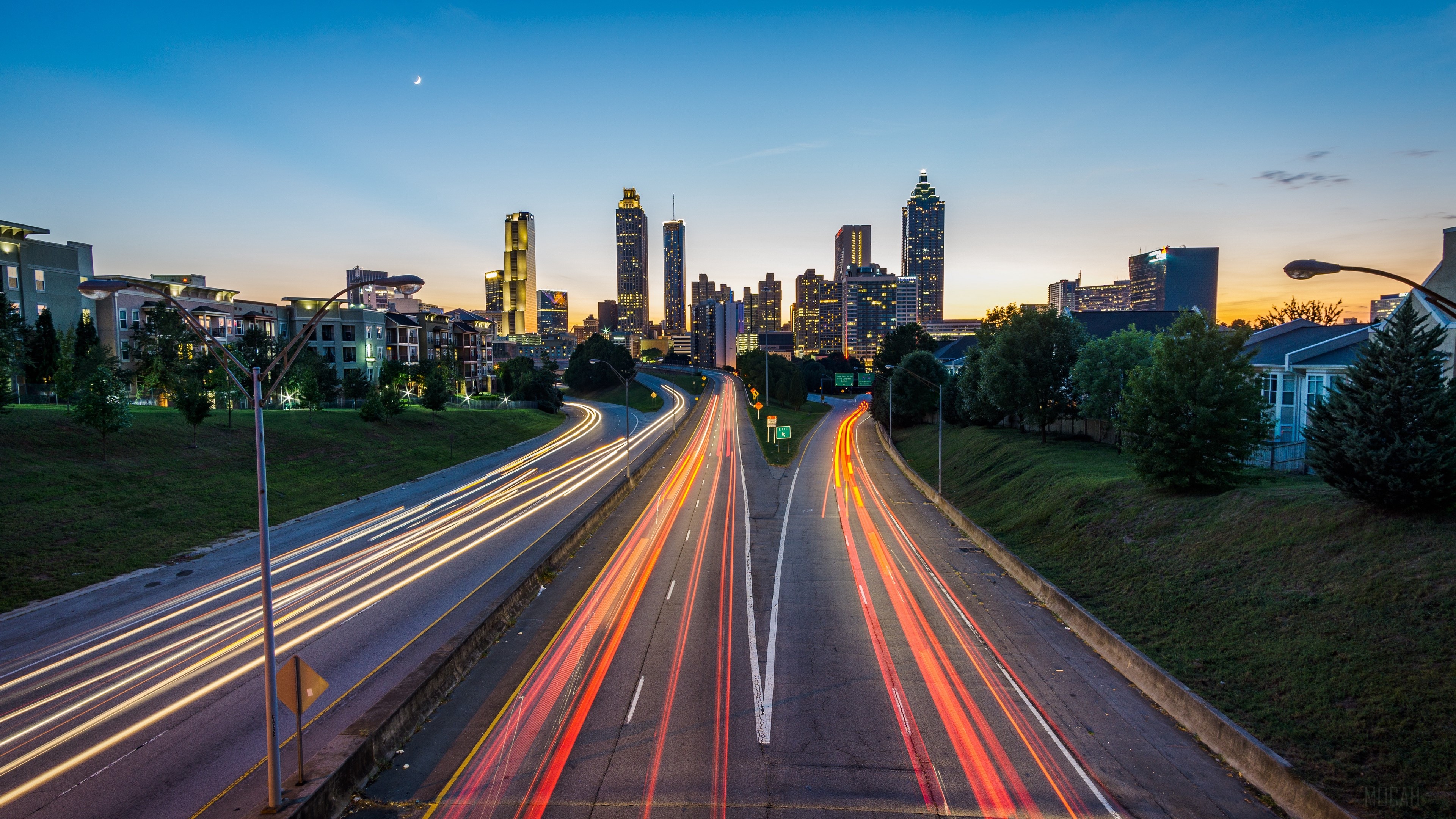 Atlanta skyscrapers and highway light trails at dusk HD Wallpaper