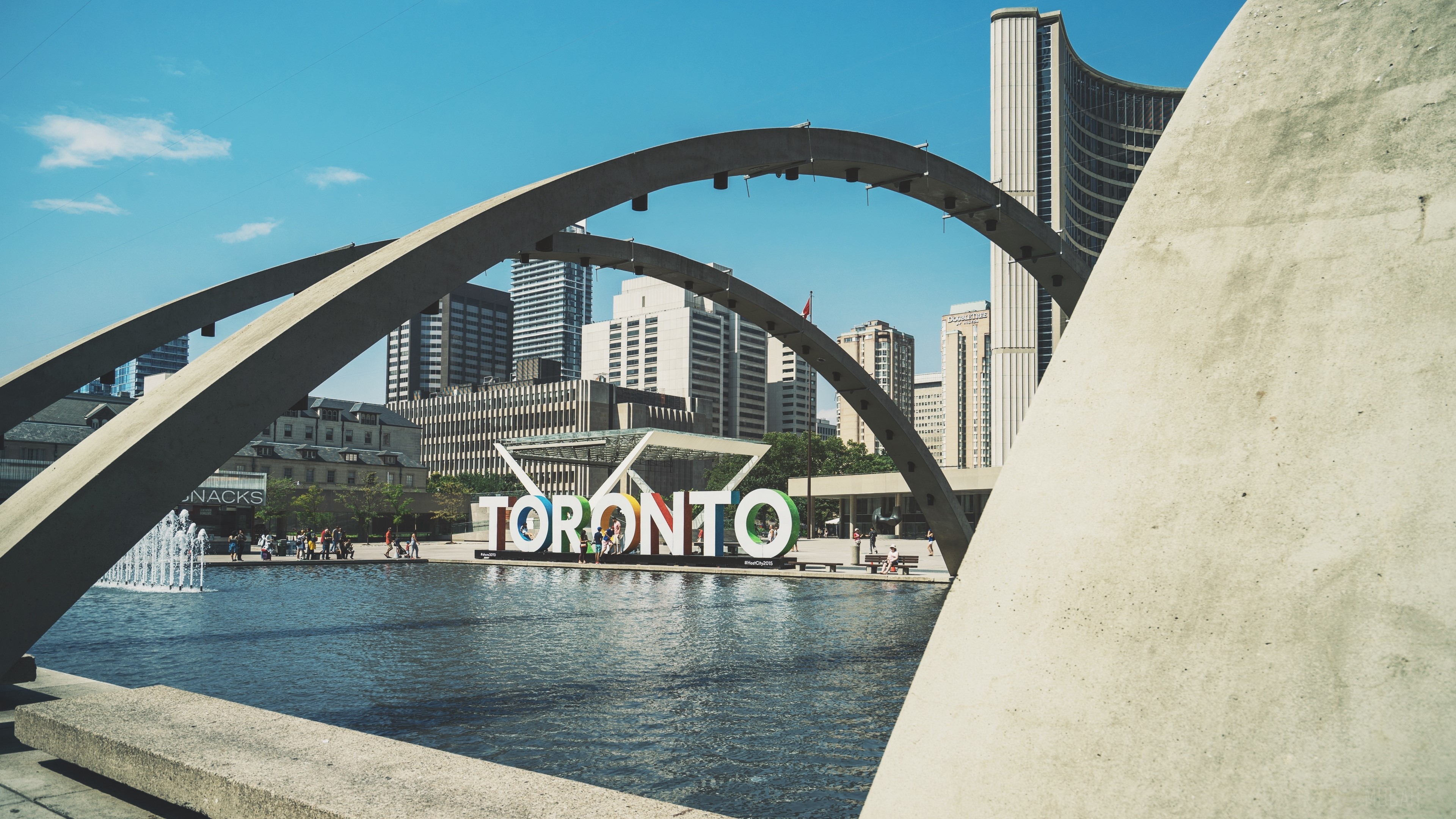 Toronto sign with city hall and arches HD Wallpaper