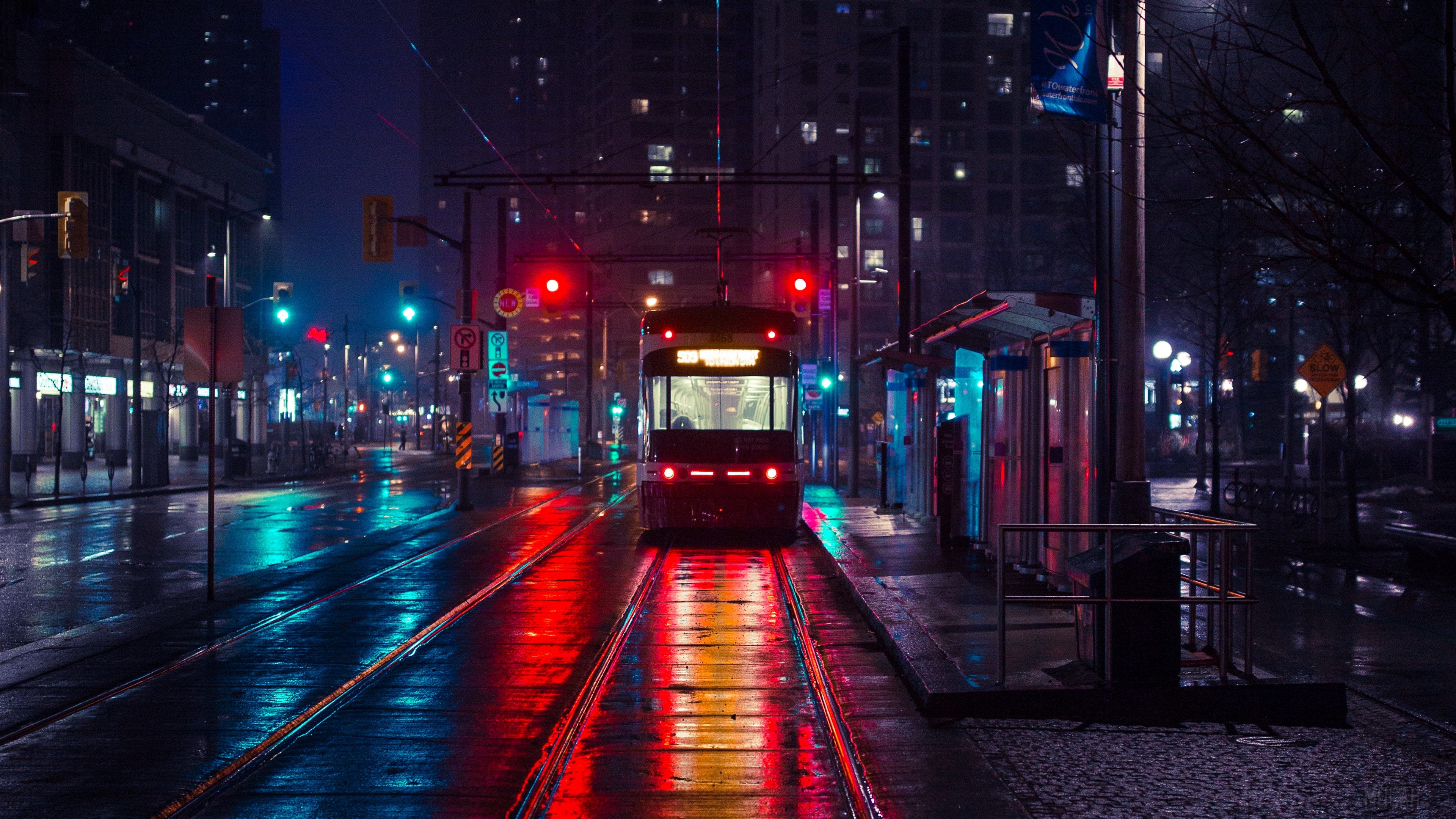 Trolley at a city stop in the evening 4K HD Wallpaper