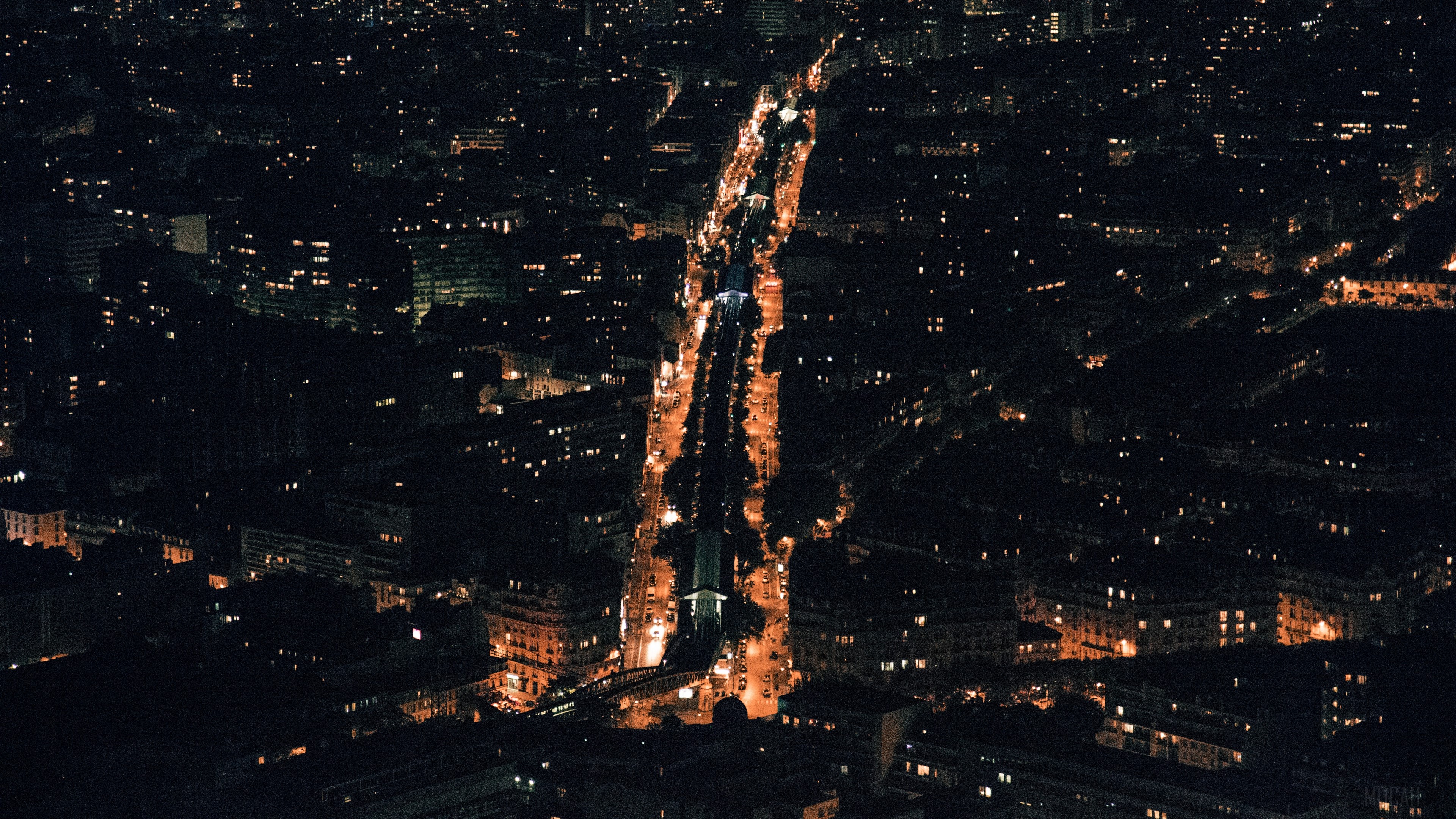 Night city skyline with illuminated streets HD Wallpaper