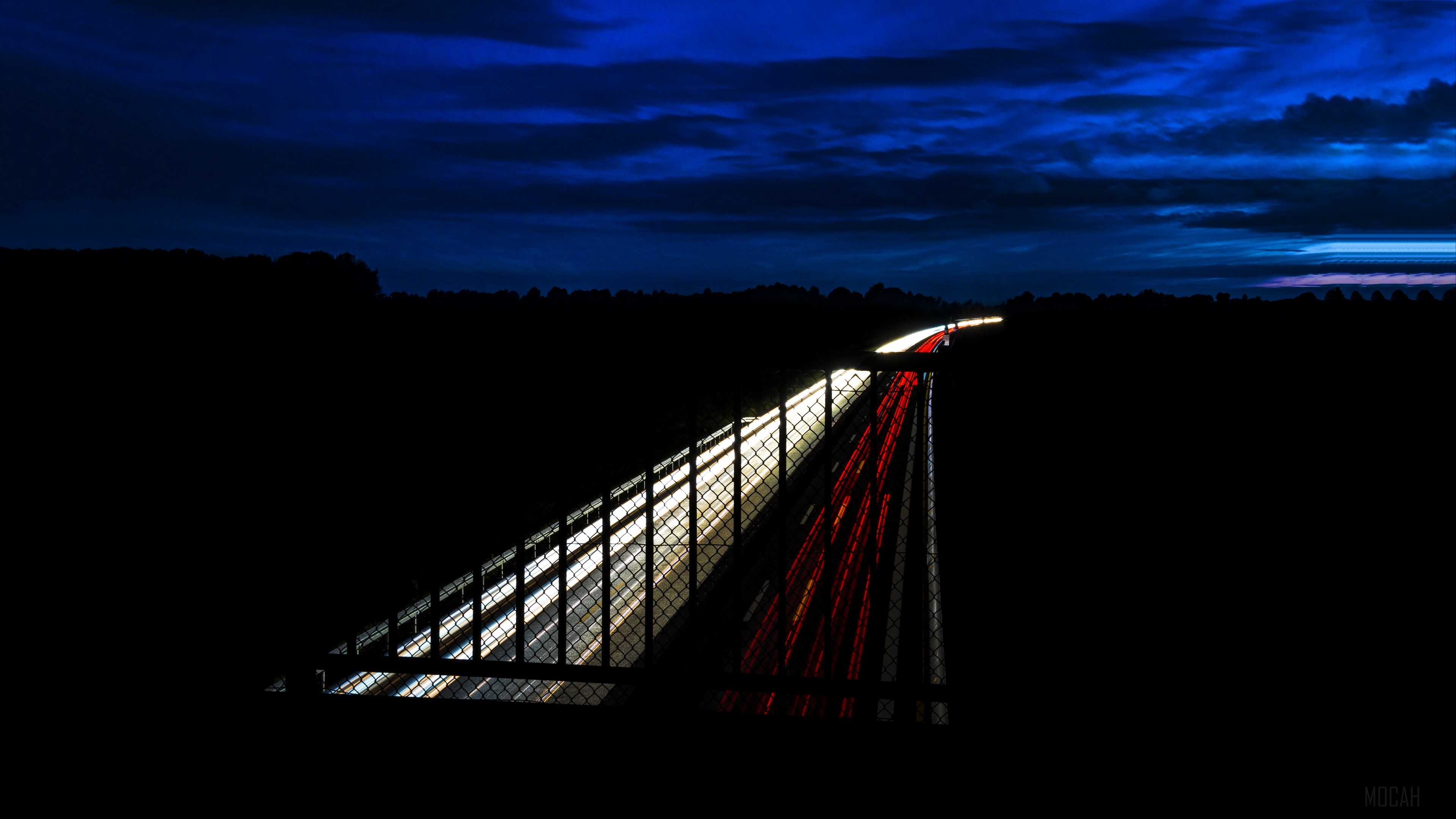 Highway at night with light trails HD Wallpaper
