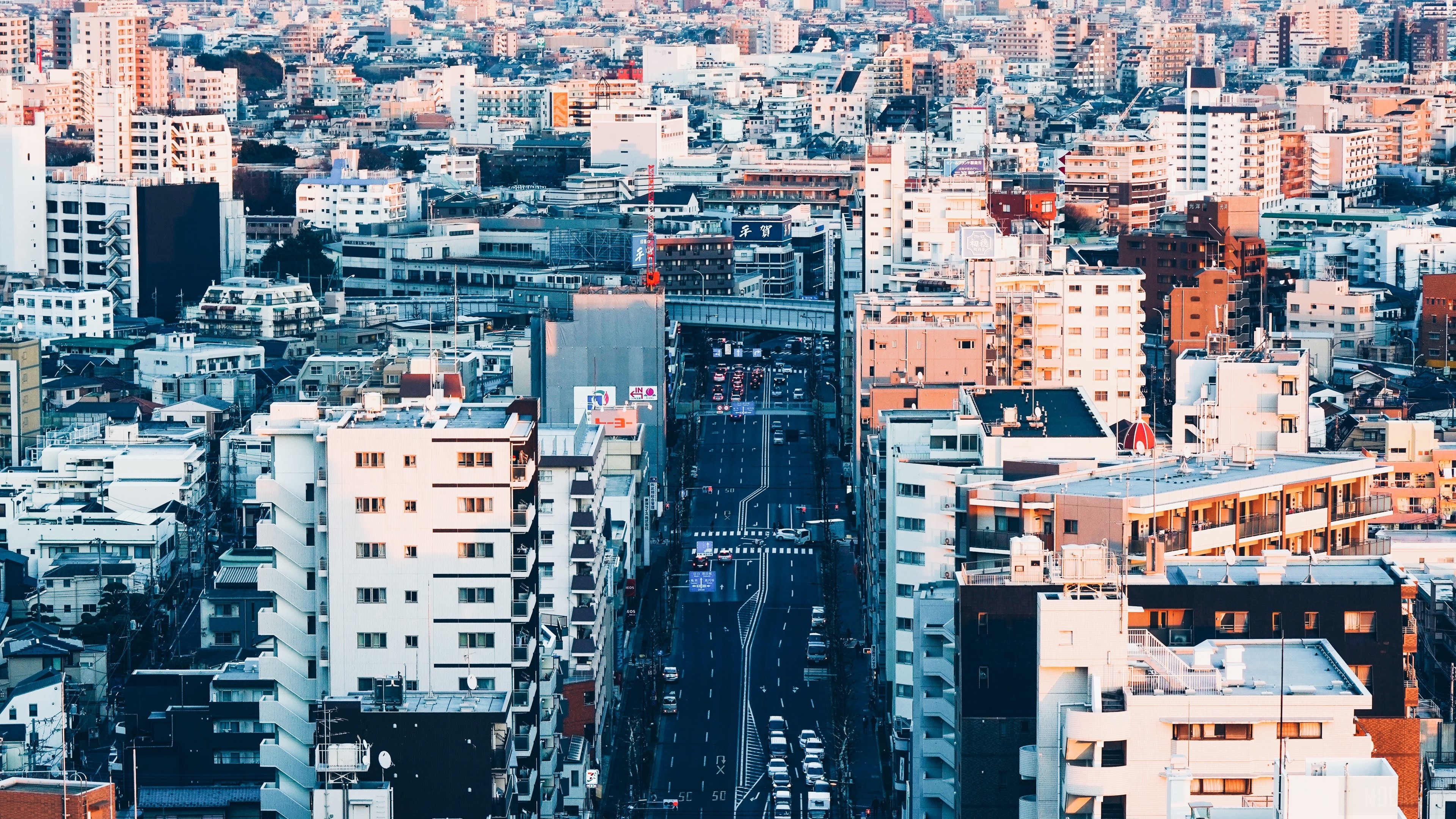 Aerial view of a dense city street in Tokyo HD Wallpaper
