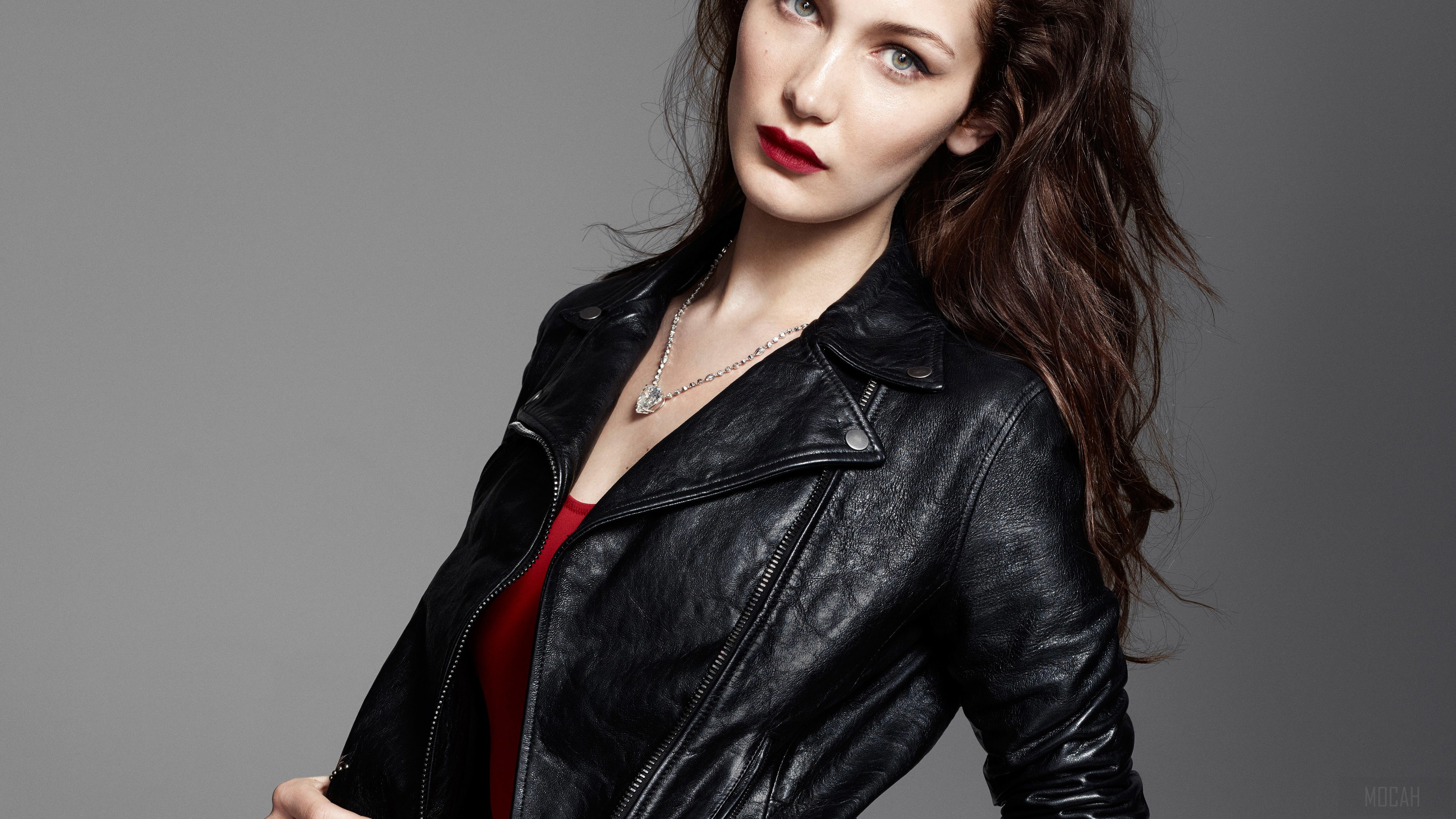 Bella Hadid in a black leather jacket HD Wallpaper