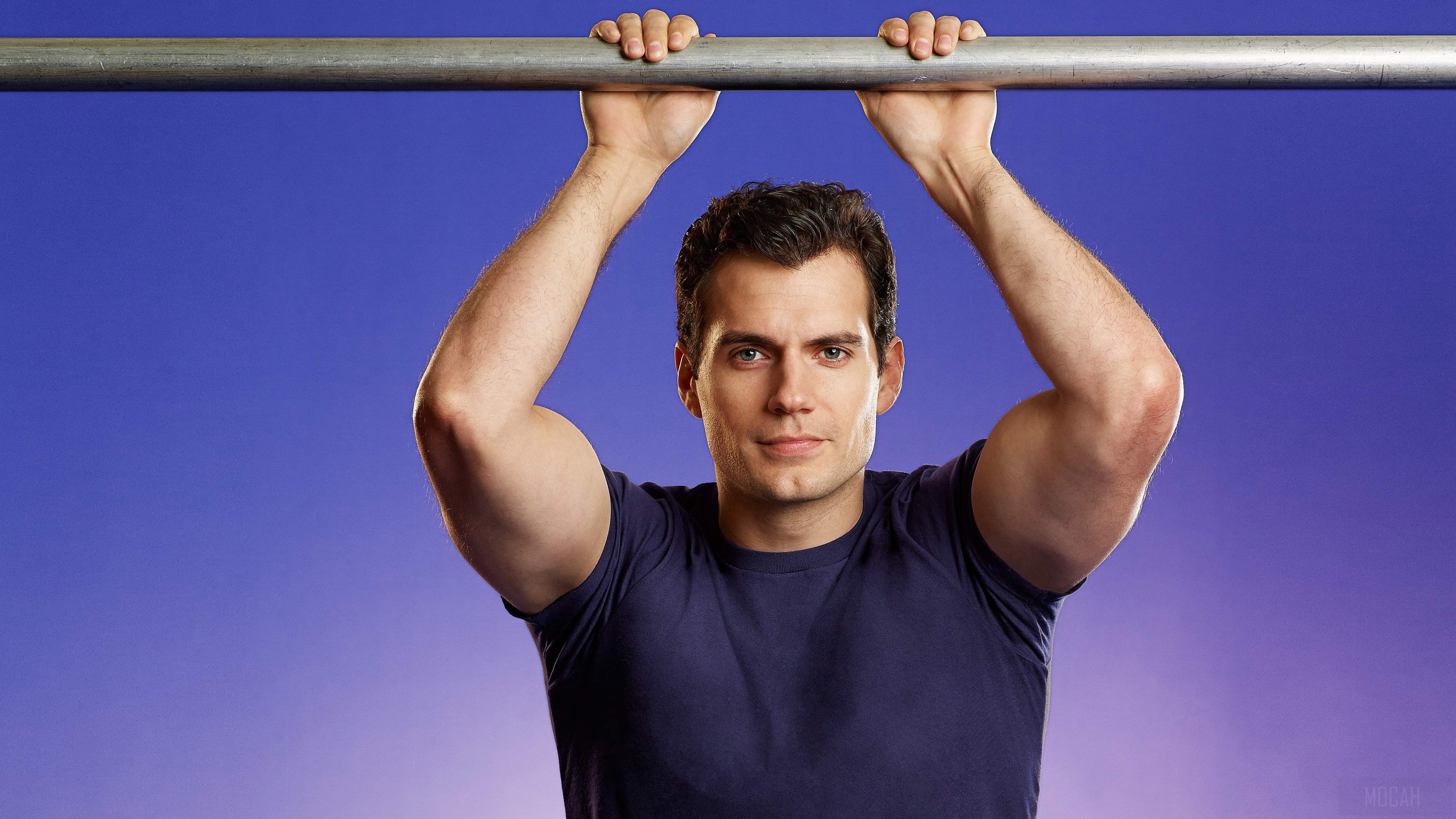 Henry Cavill hanging on a bar HD Wallpaper