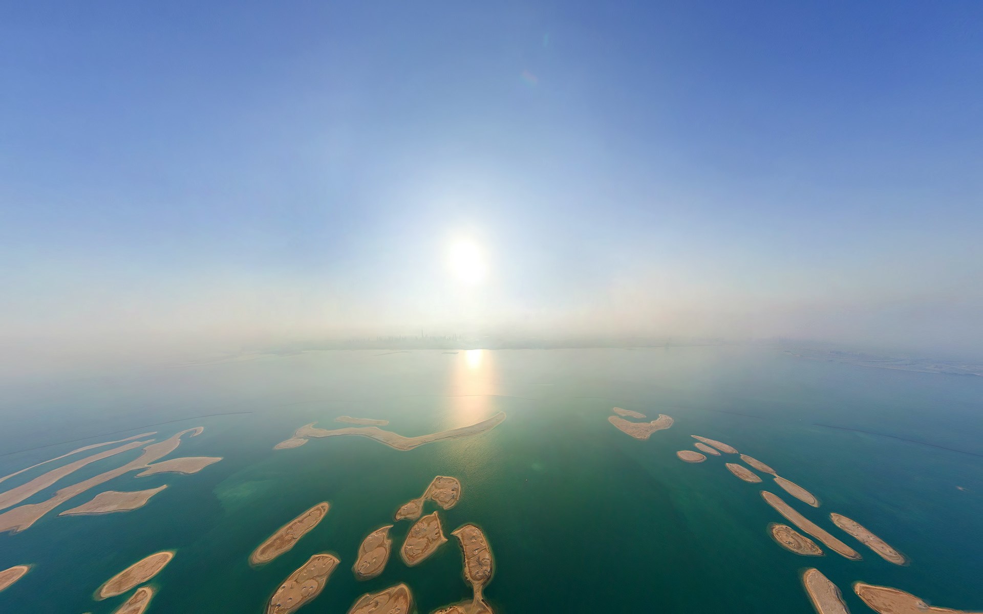 Artificial islands in the sea at sunset HD Wallpaper
