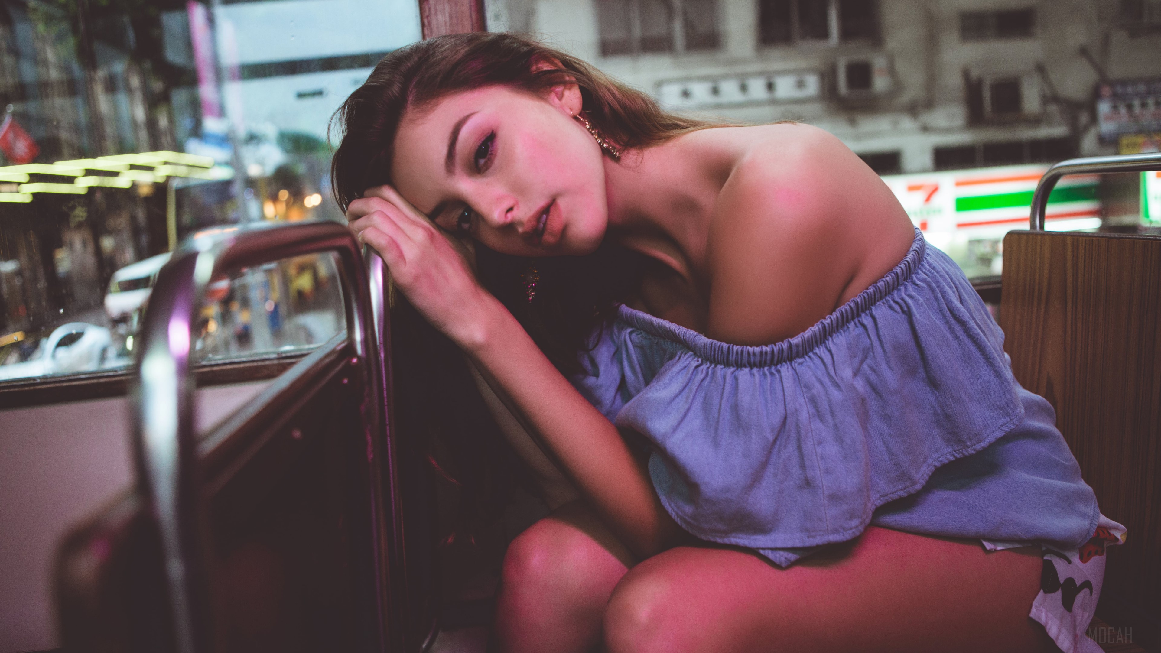 Celine Farach on a tram in the city 4K HD Wallpaper