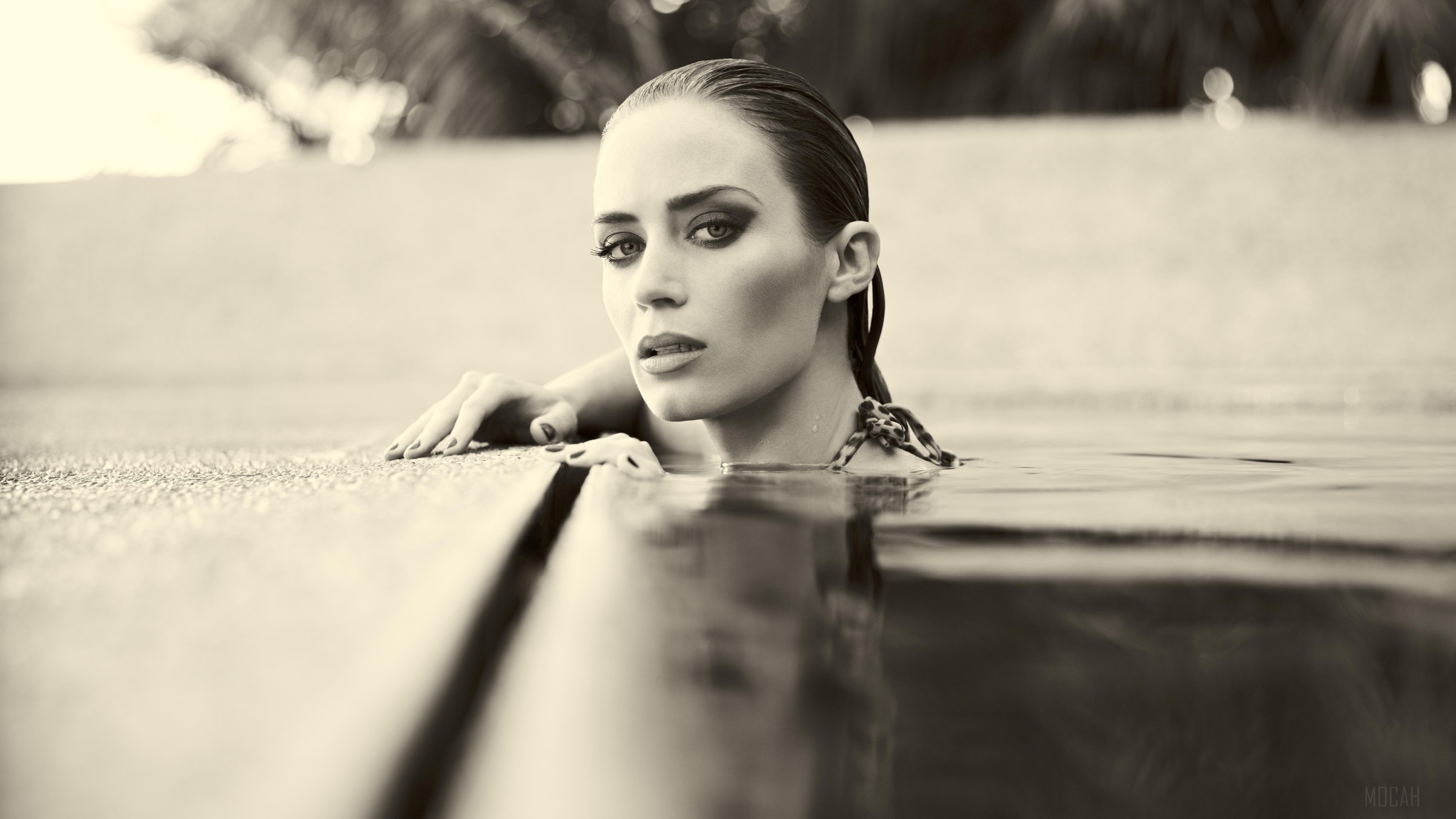 Emily Blunt in a swimming pool HD Wallpaper