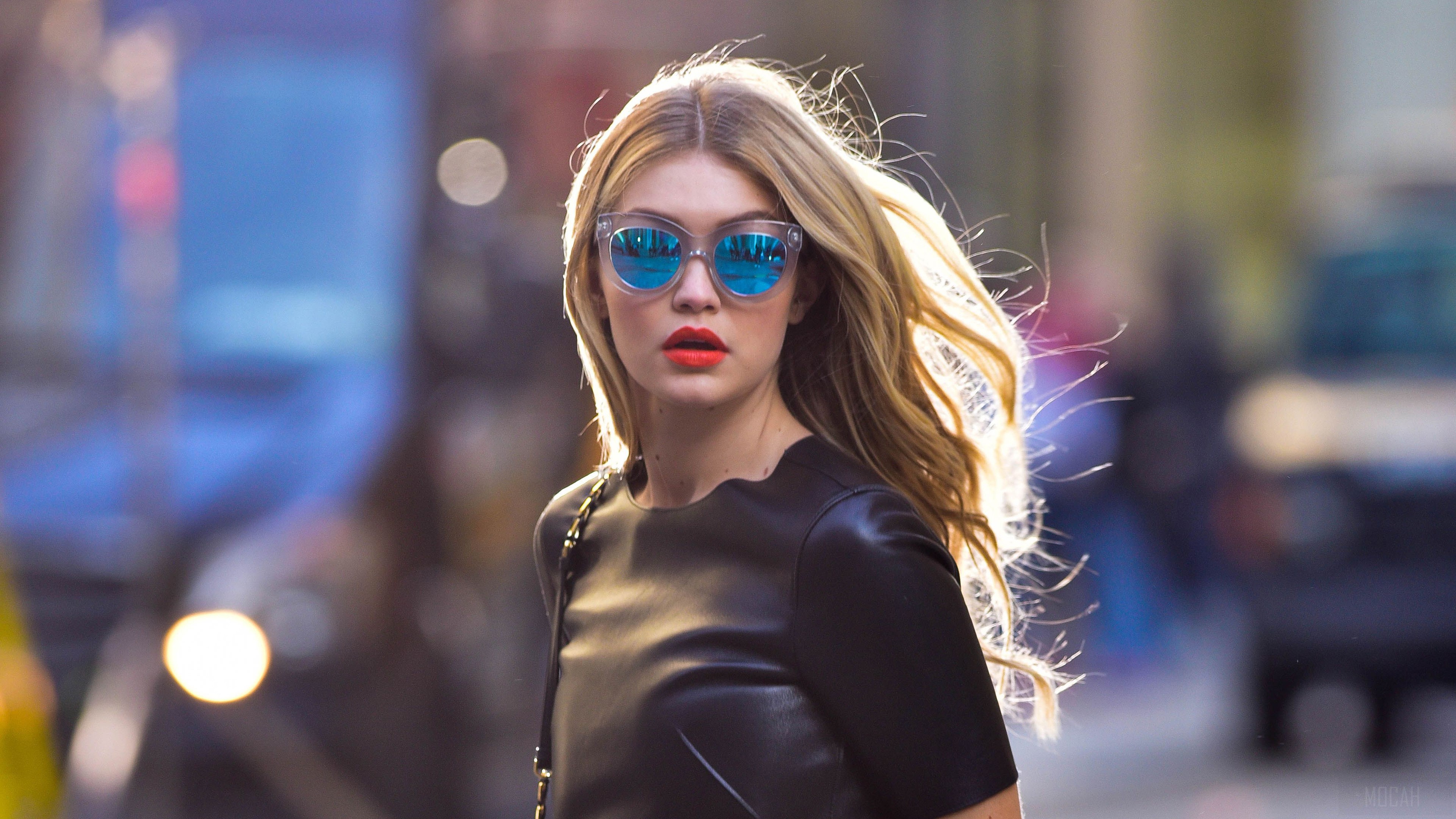 Gigi Hadid wearing sunglasses and a black dress HD Wallpaper