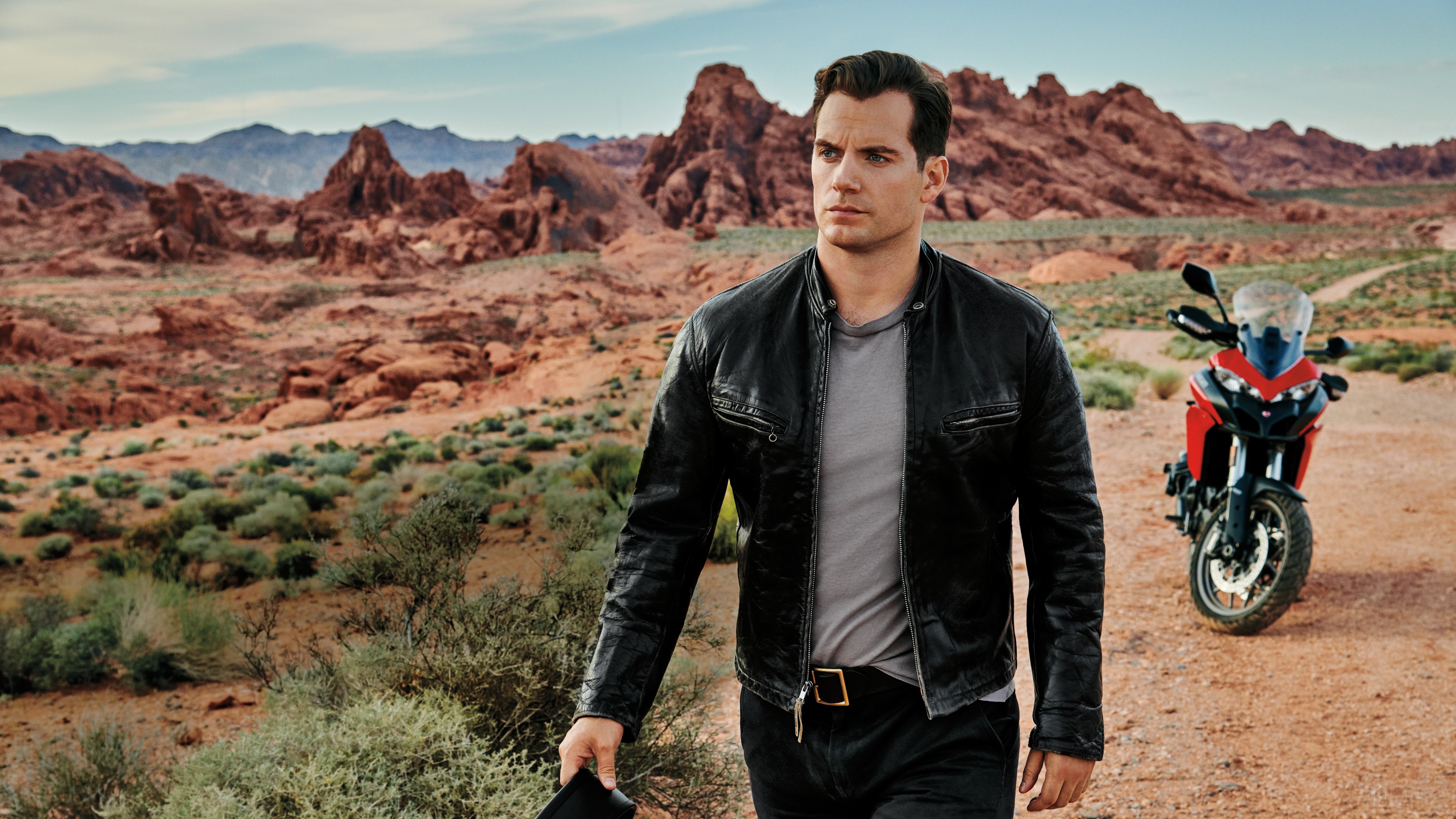 Henry Cavill in desert with motorcycle 4K HD Wallpaper