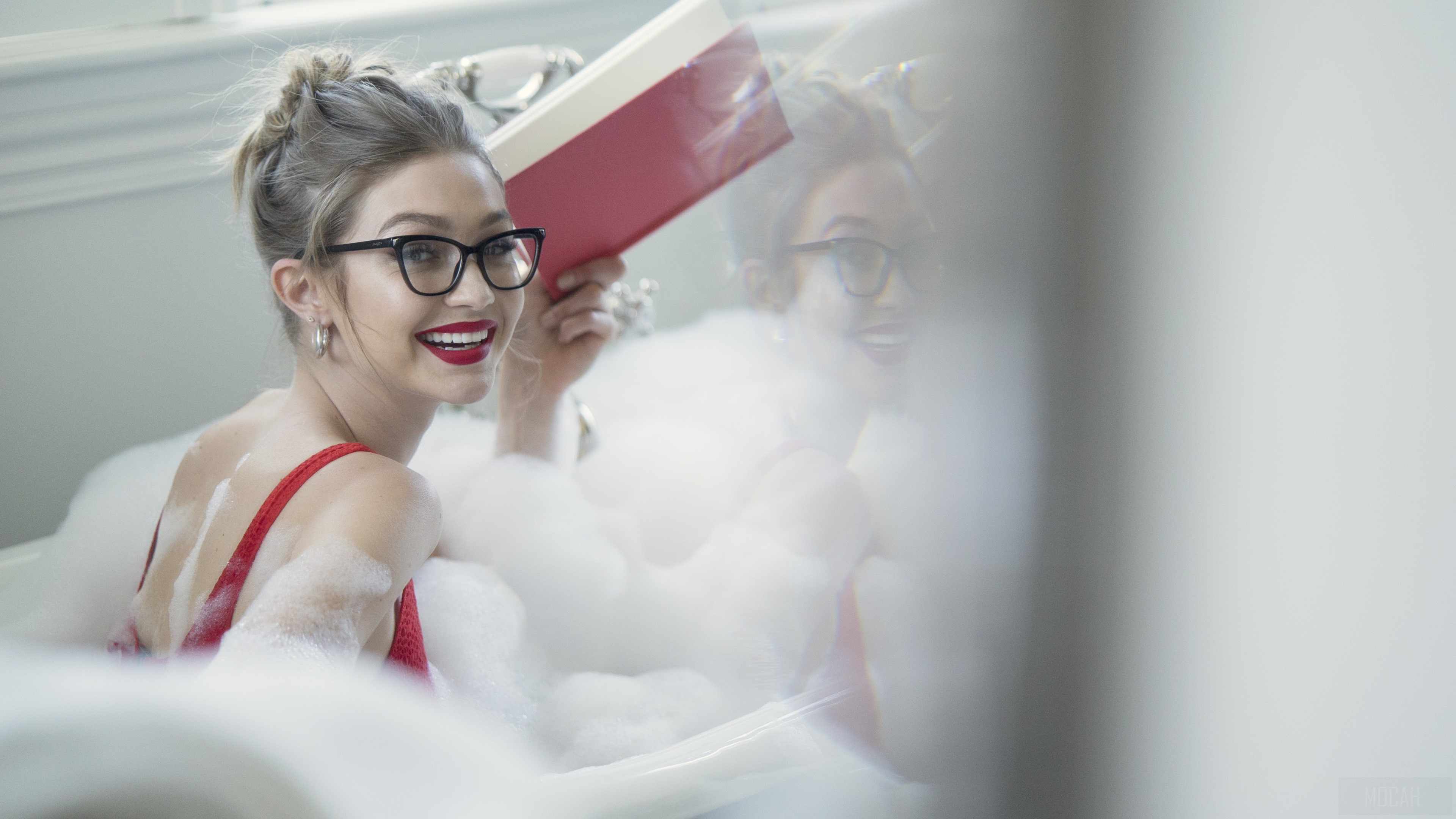 Gigi Hadid wearing Vogue Eyewear in a bathtub HD Wallpaper
