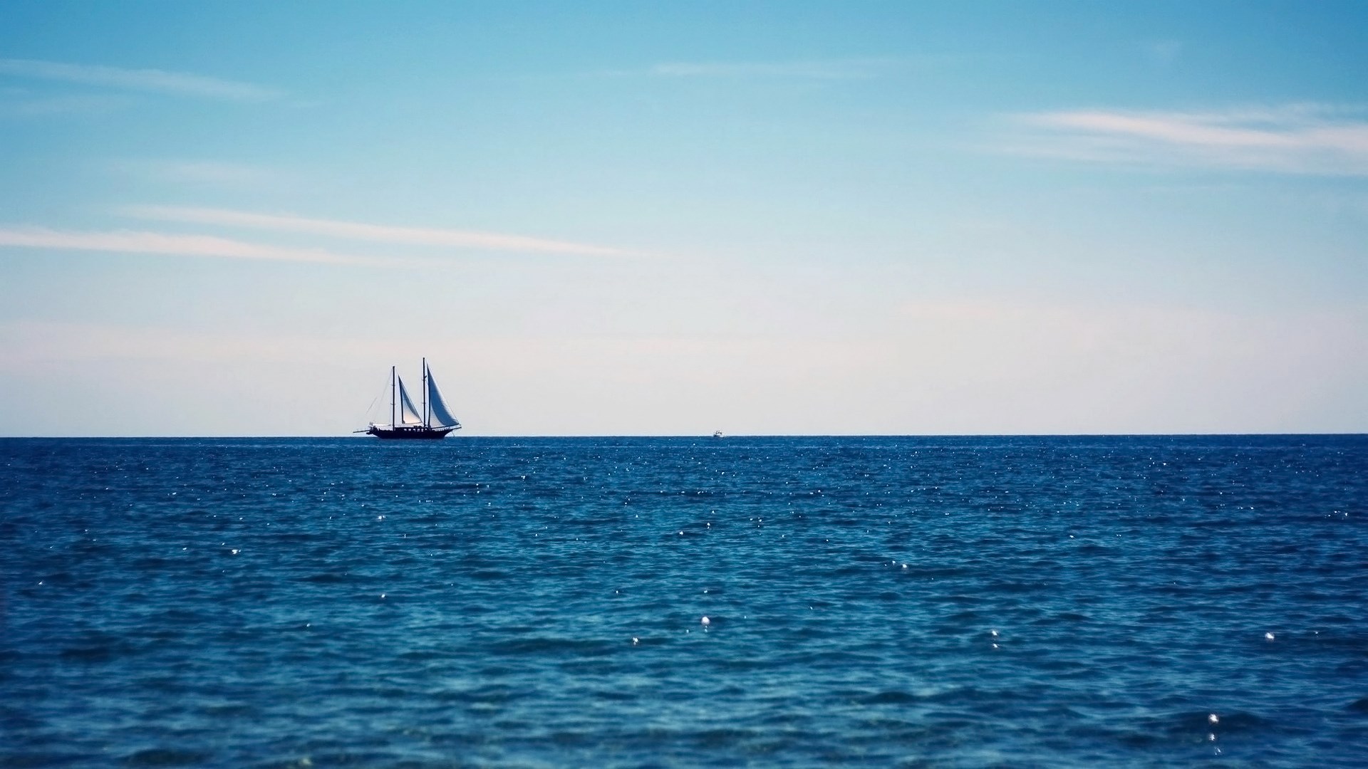Sailboat on the blue ocean under a clear sky HD Wallpaper