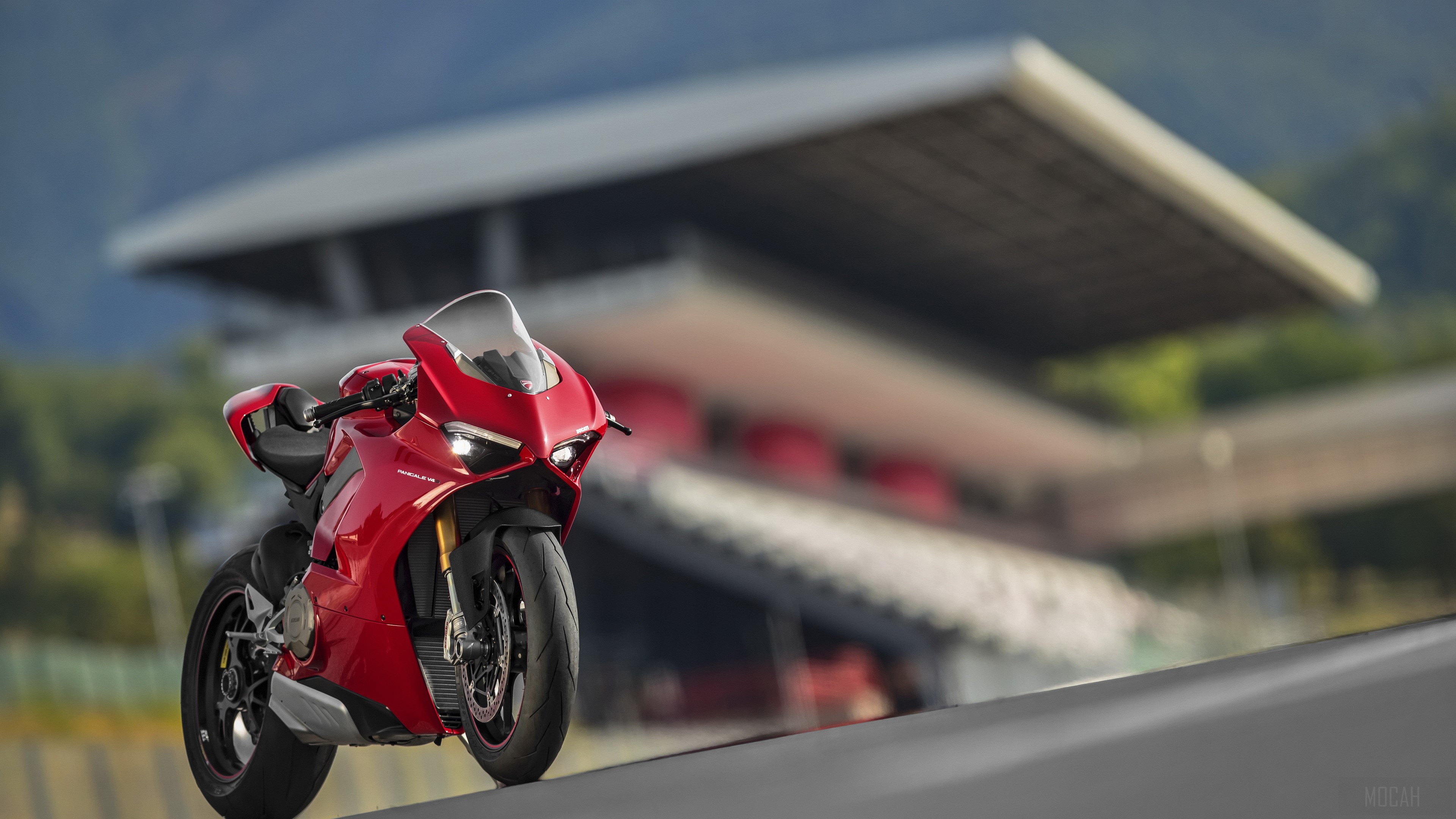 Red Ducati Panigale V4 S motorcycle on a track HD Wallpaper