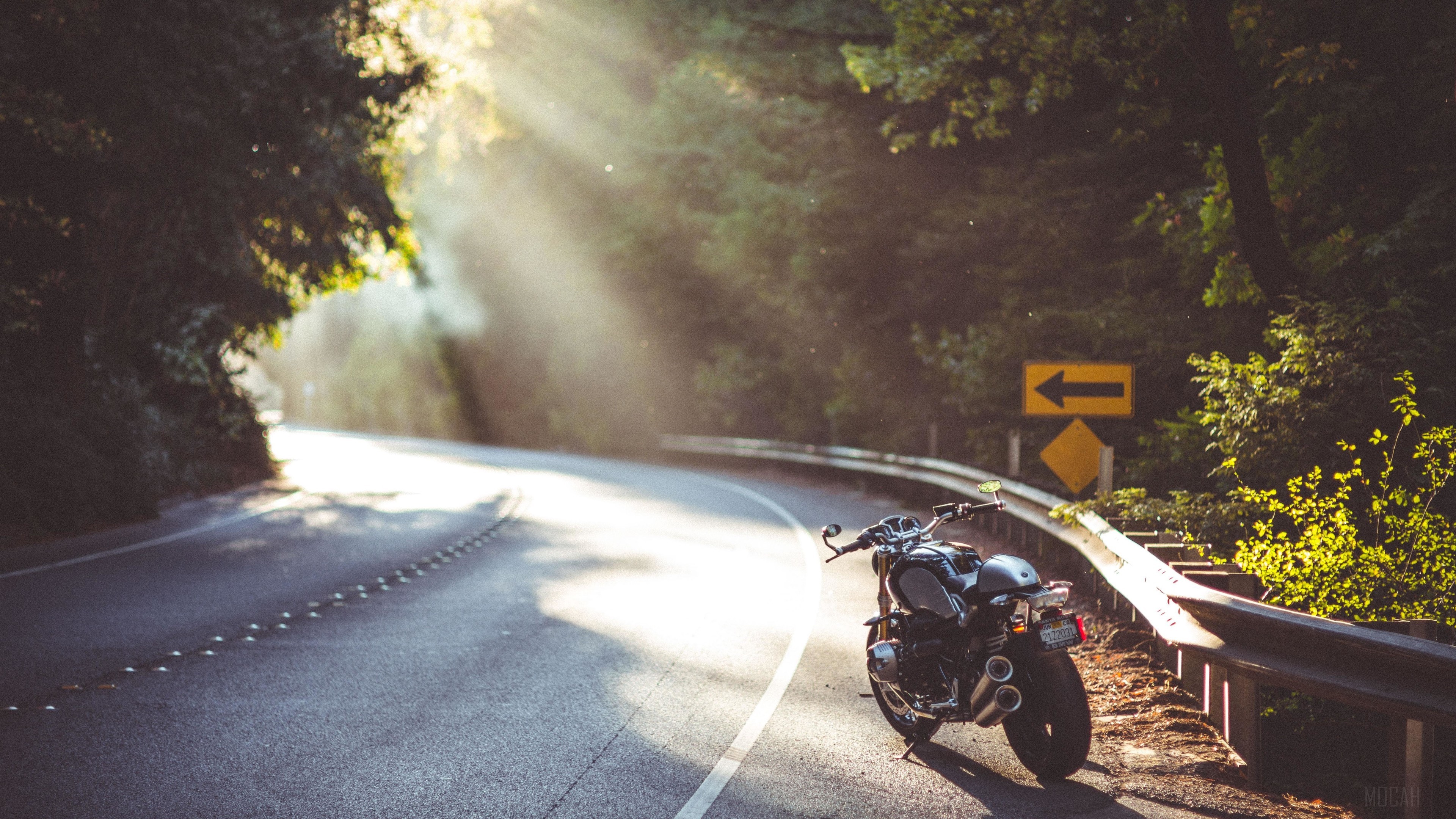 BMW R nineT motorcycle on a winding road HD Wallpaper