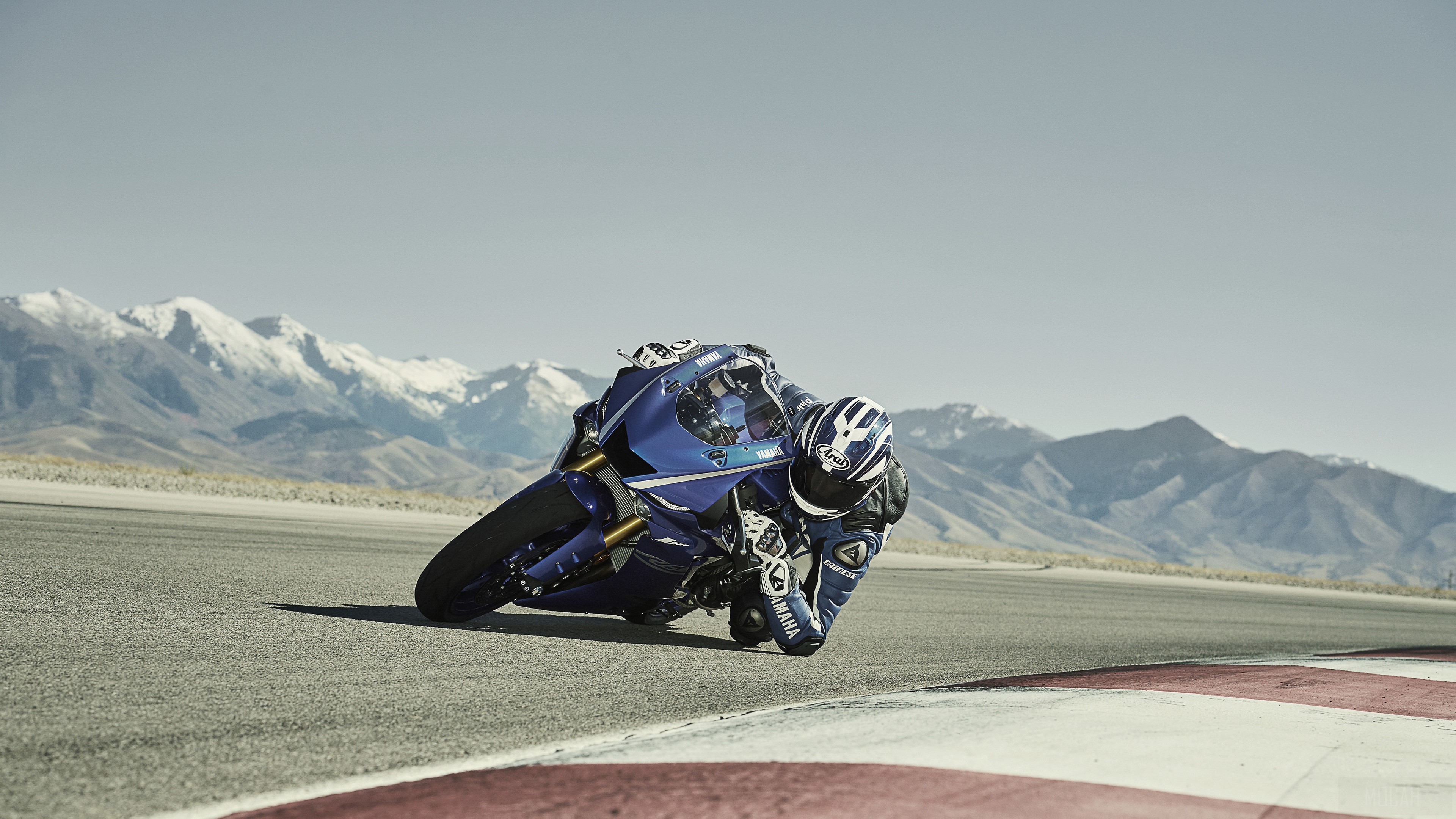 Yamaha R6 motorcycle on a race track with mountains HD Wallpaper