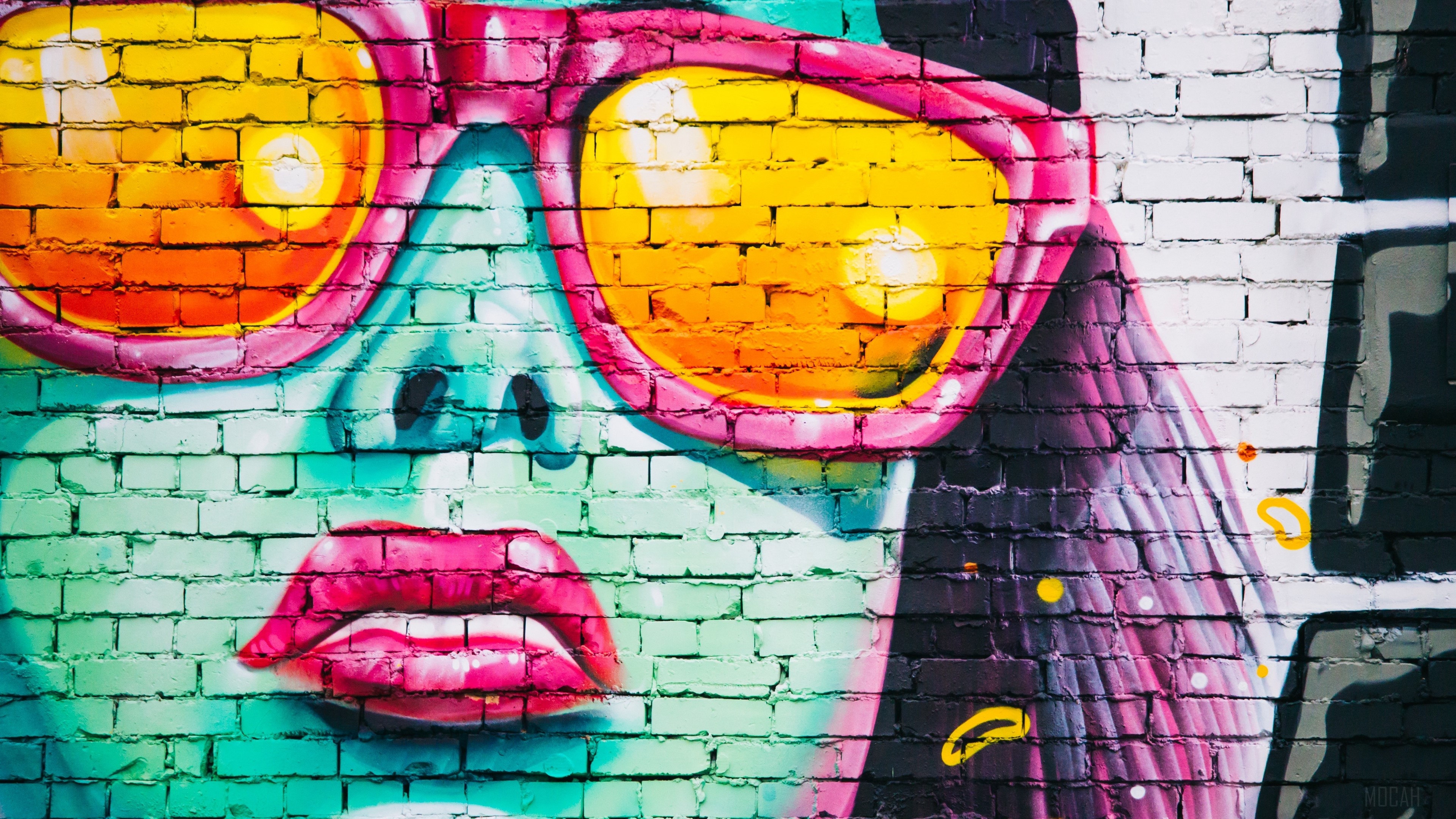 Graffiti of a girl with pink sunglasses on a brick wall HD Wallpaper
