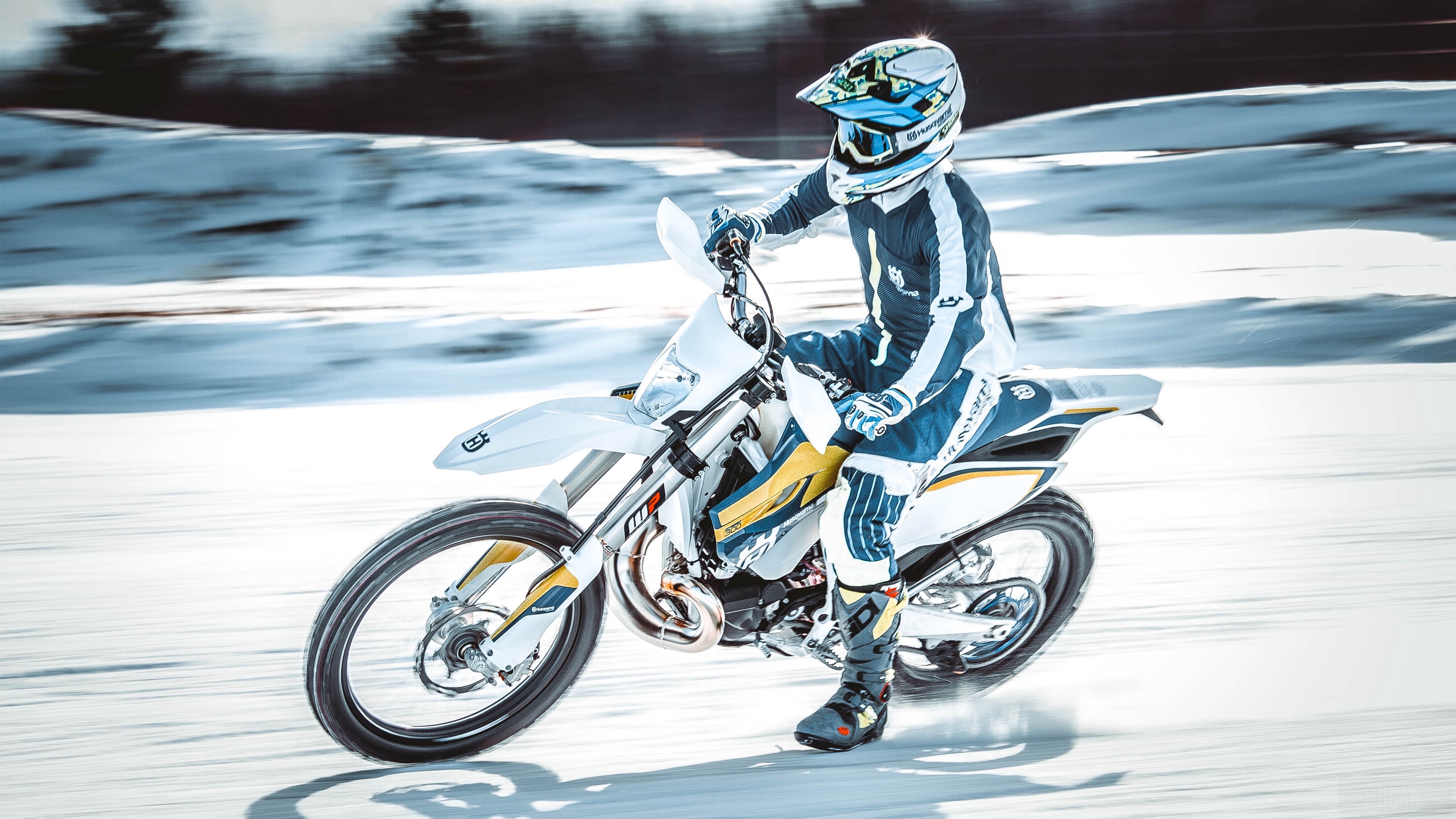 Motorcyclist riding on snow in 4K HD Wallpaper