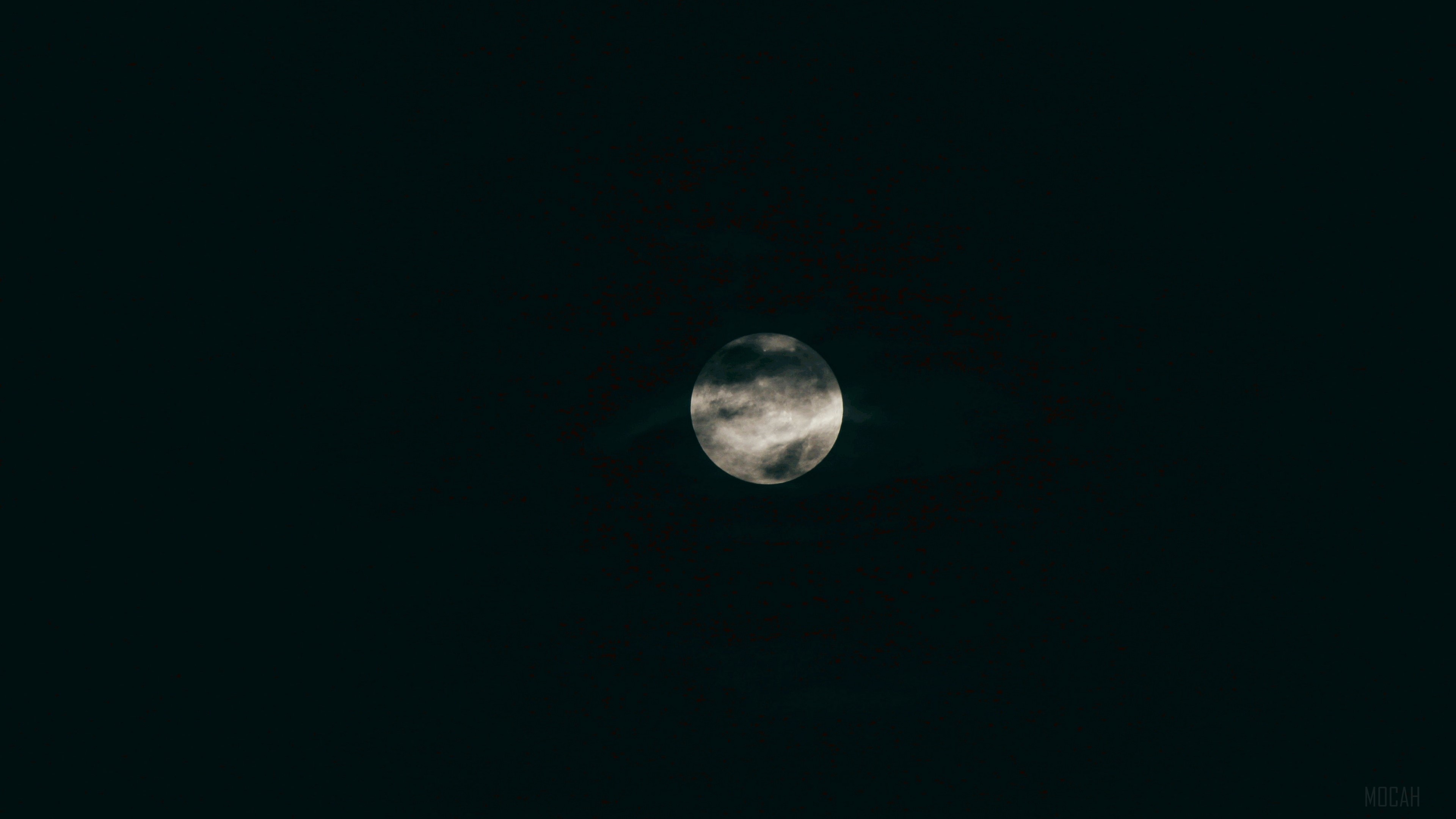 Full moon partially obscured by clouds 4K HD Wallpaper