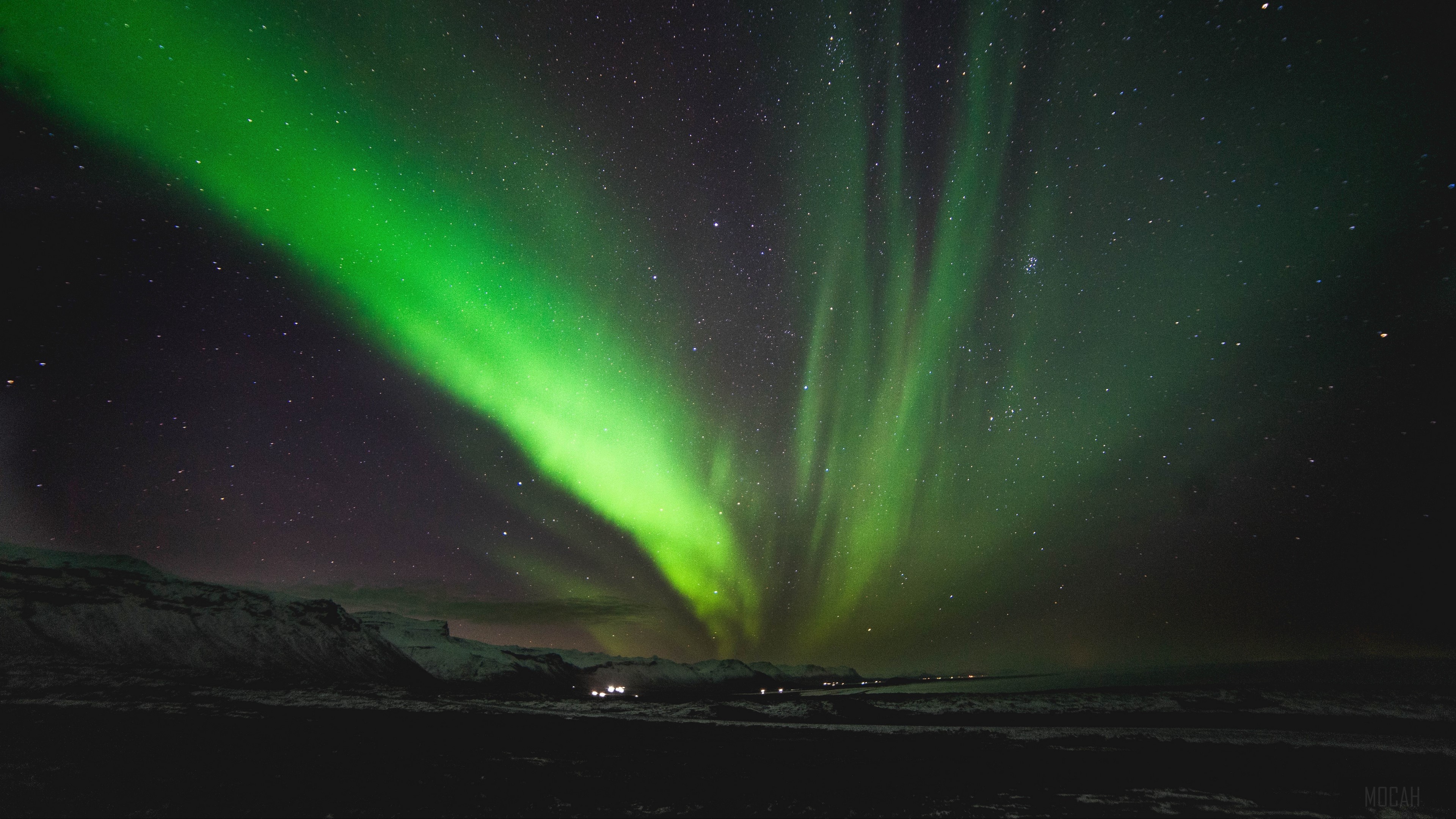 Green Aurora Borealis Over Snowy Landscape 4K HD Wallpaper