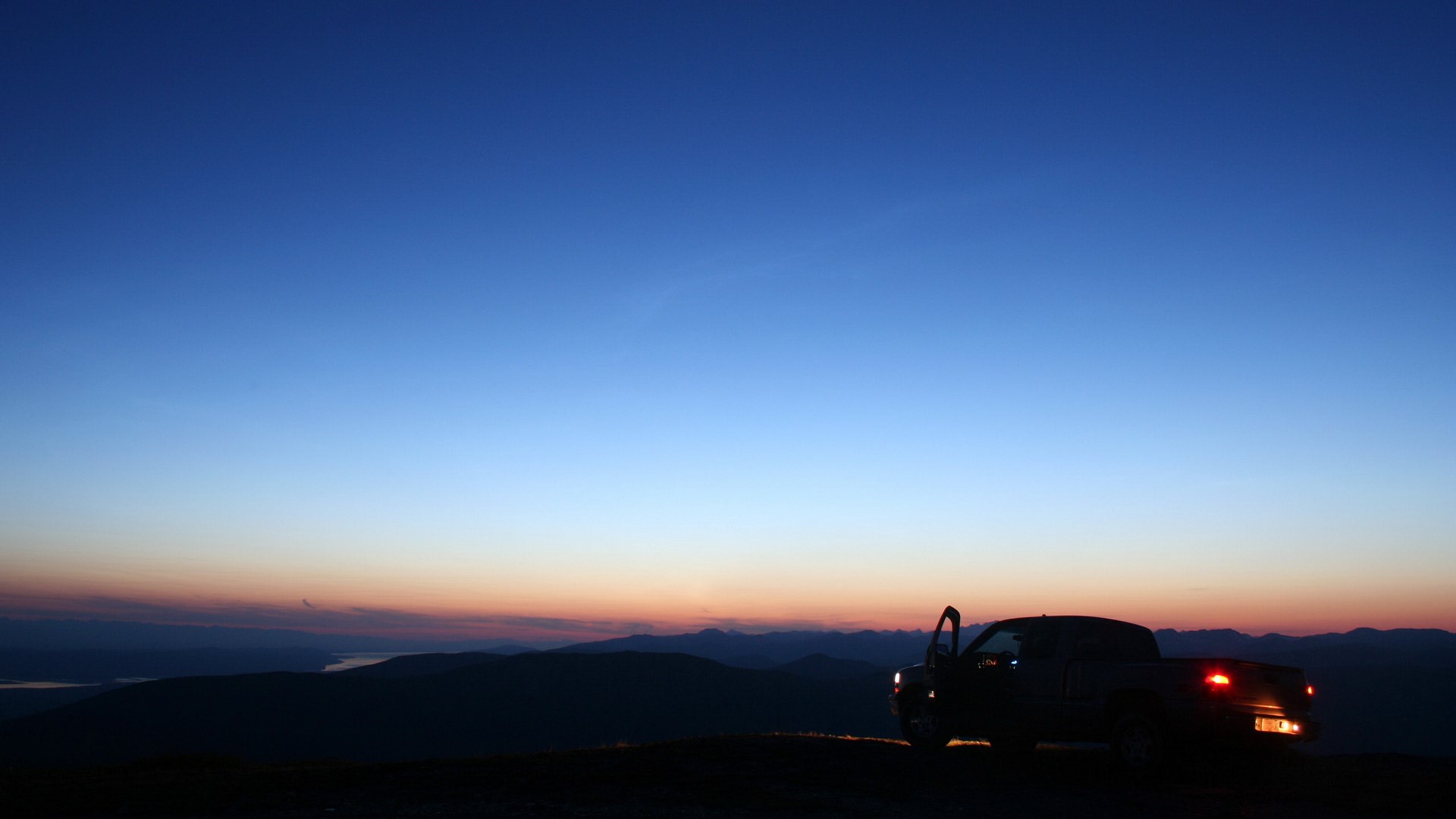 Pickup truck parked on a hill at dusk HD Wallpaper