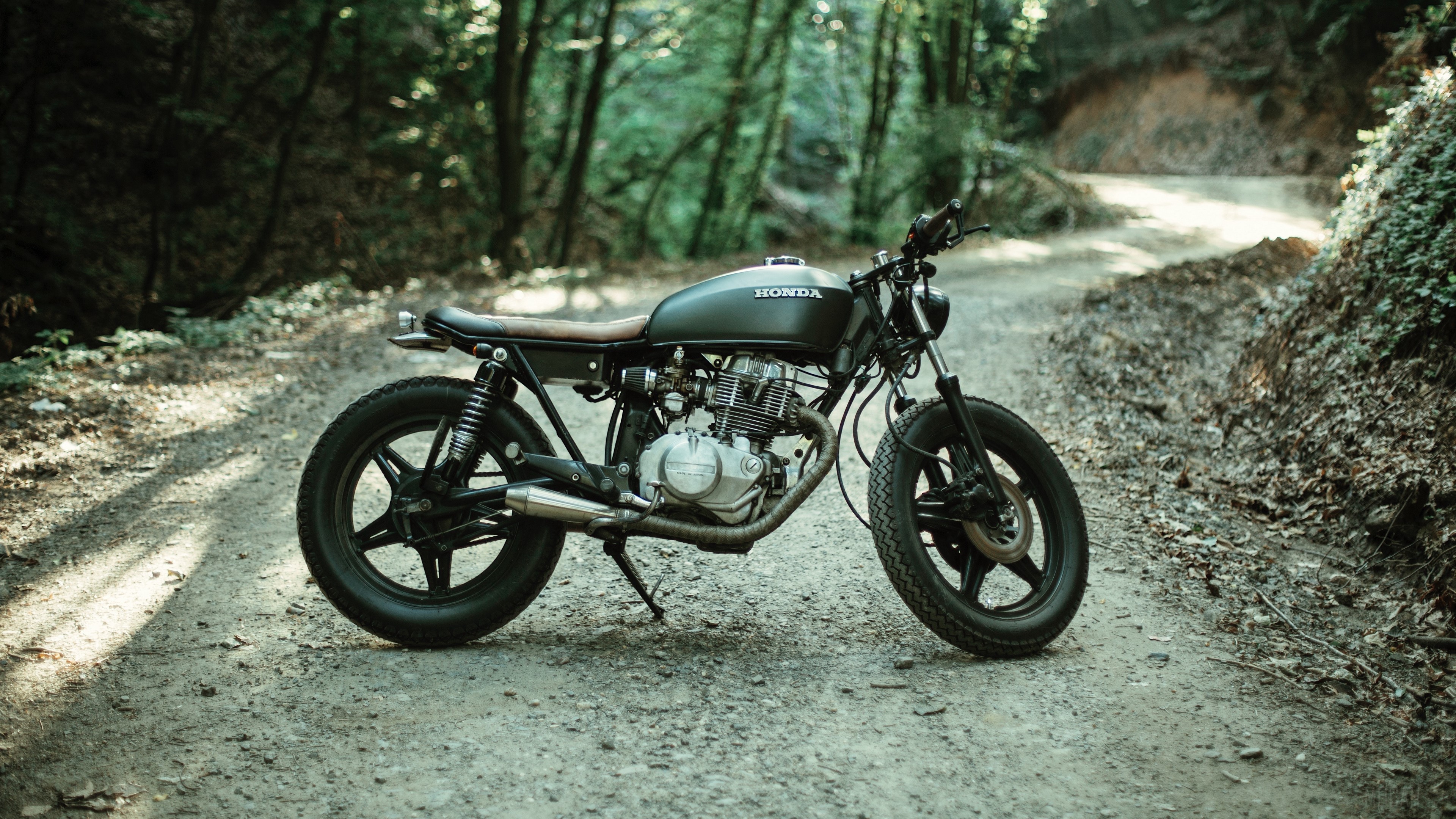 Honda motorcycle on a forest road 4K HD Wallpaper
