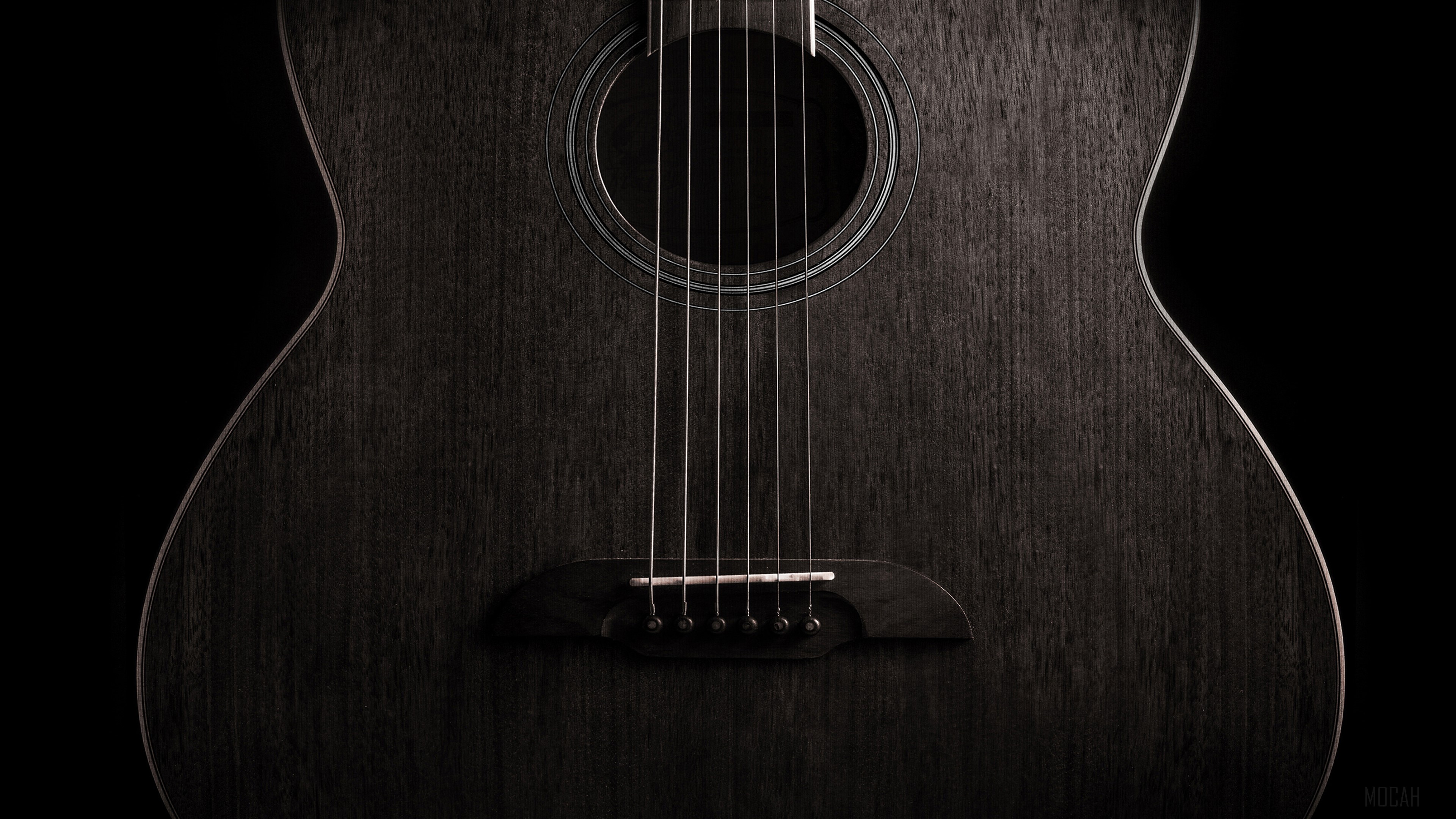 Close-up of a dark acoustic guitar HD Wallpaper