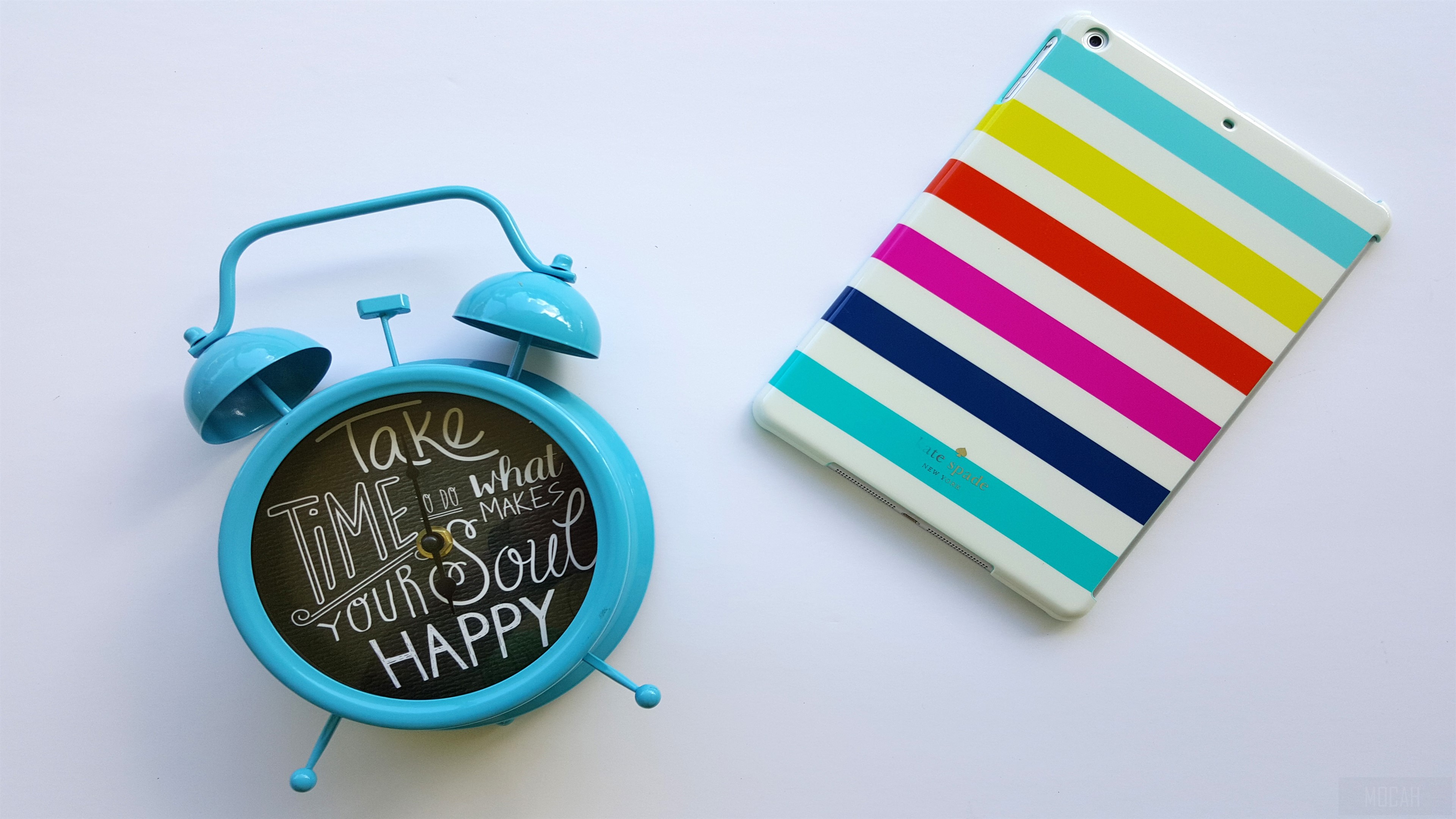 Blue alarm clock and striped tablet case HD Wallpaper