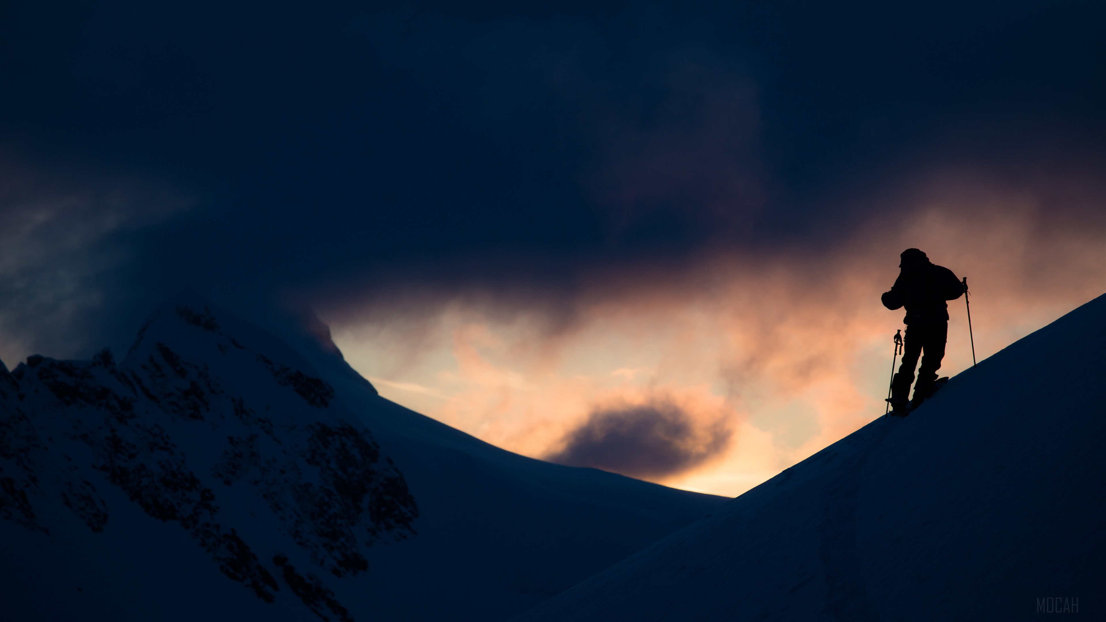 Silhouette of skier on snowy mountain at sunset 4K HD Wallpaper